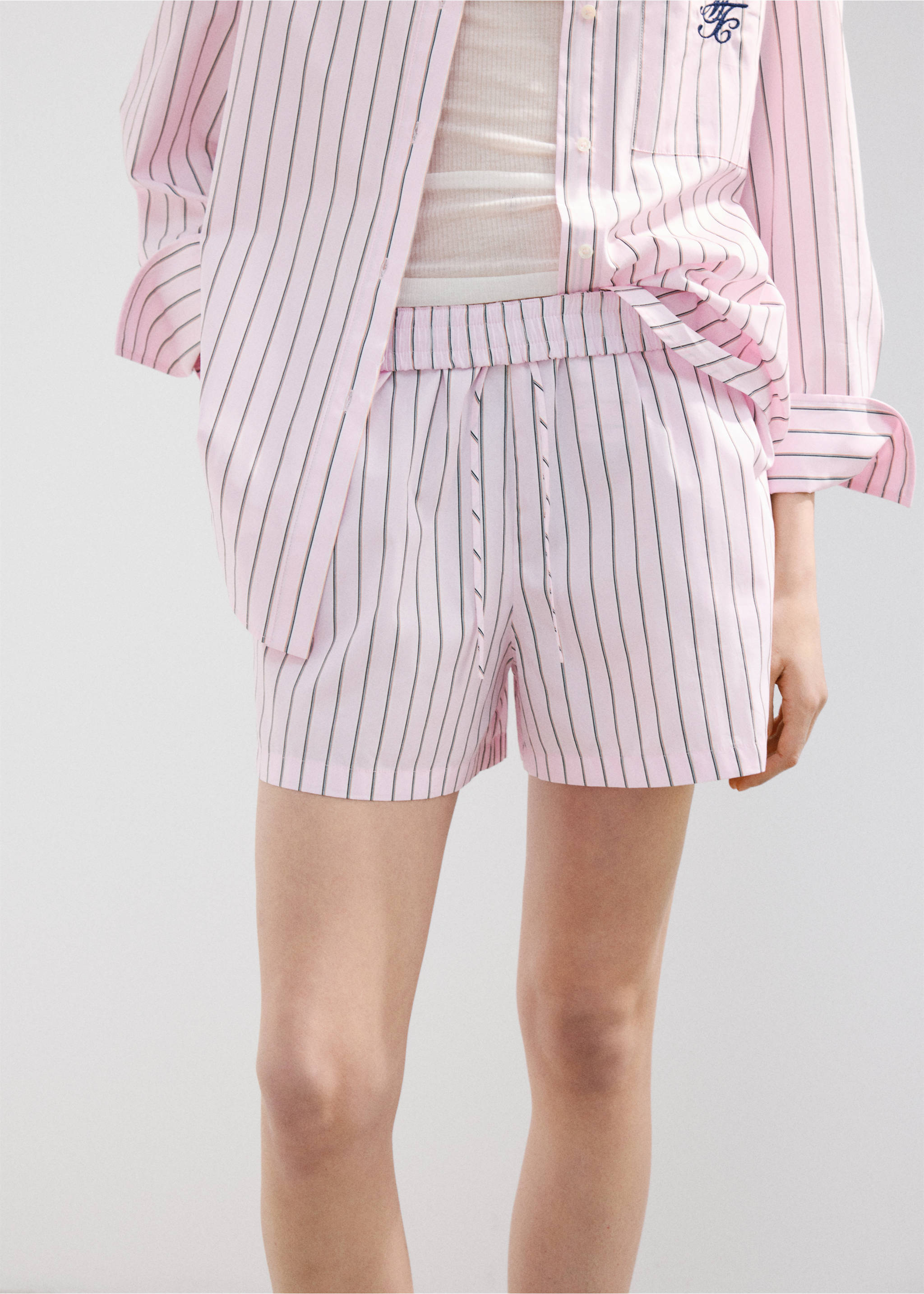 Striped poplin shorts with embroidered message - Details of the article 6, Pastel Pink. Ref: 27077167-00.
