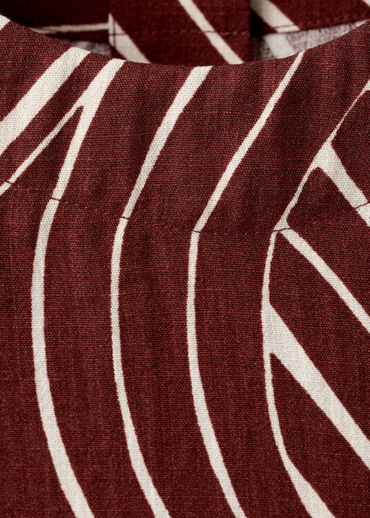 Geometric print top — Maroon