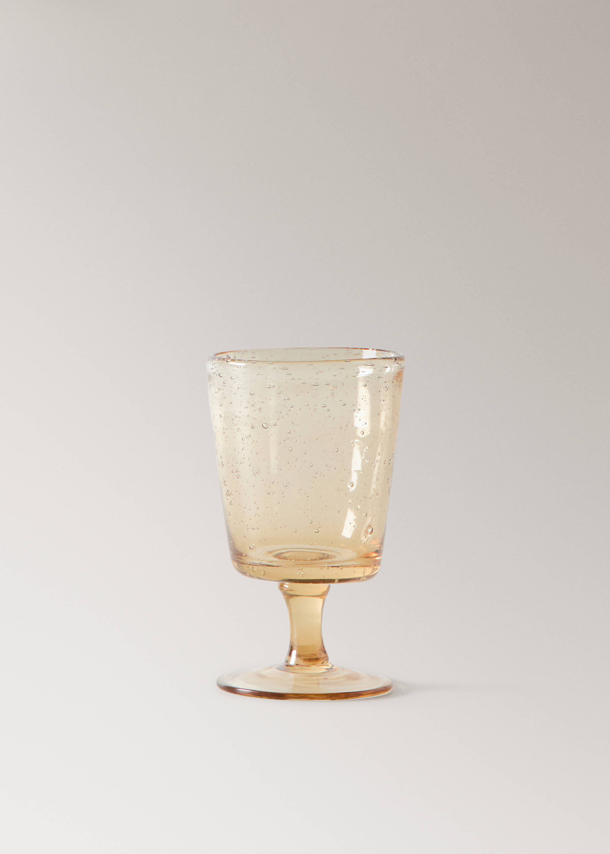 Färgat glas på fot med bubblor - Artikel utan modell