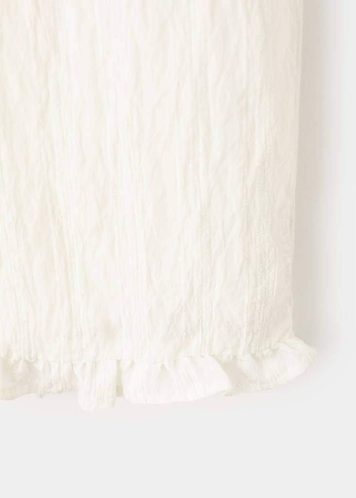 Textured trousers with ruffled hem — Ecru