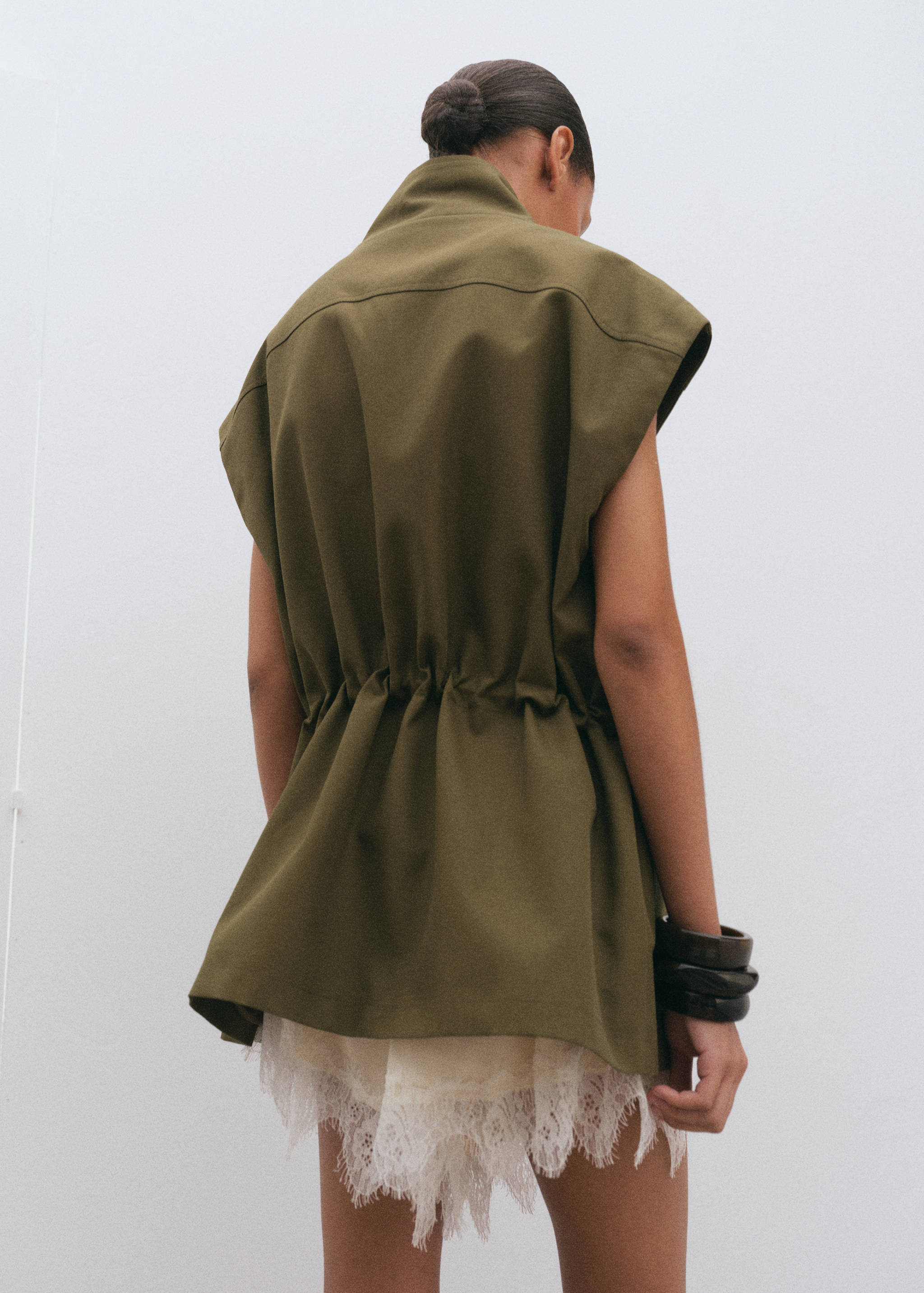 High neck waistcoat with pockets - Reverse of the article