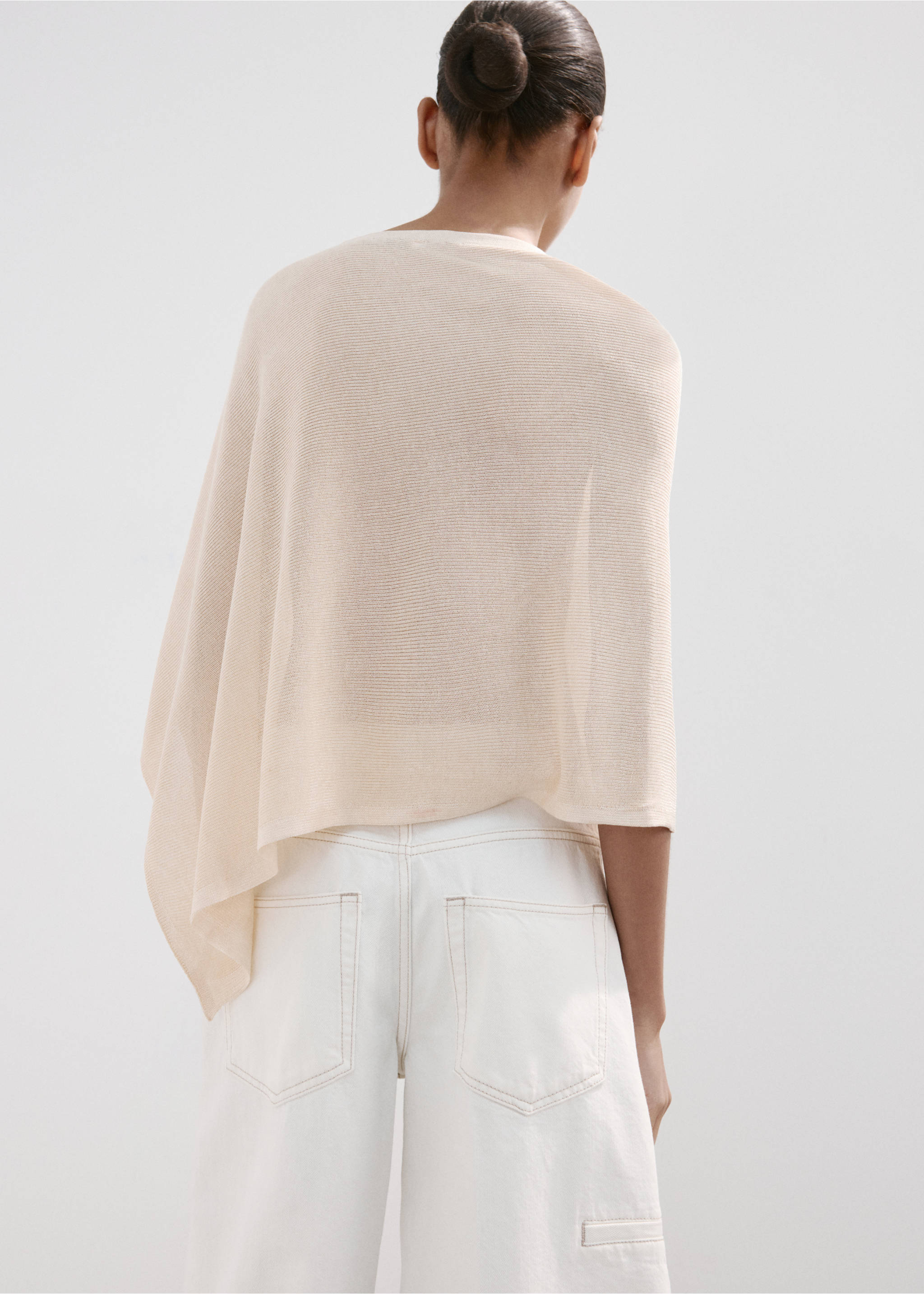 Asymmetrical knitted cape - Reverse of the article, Pastel Yellow. Ref: 27087143-00.