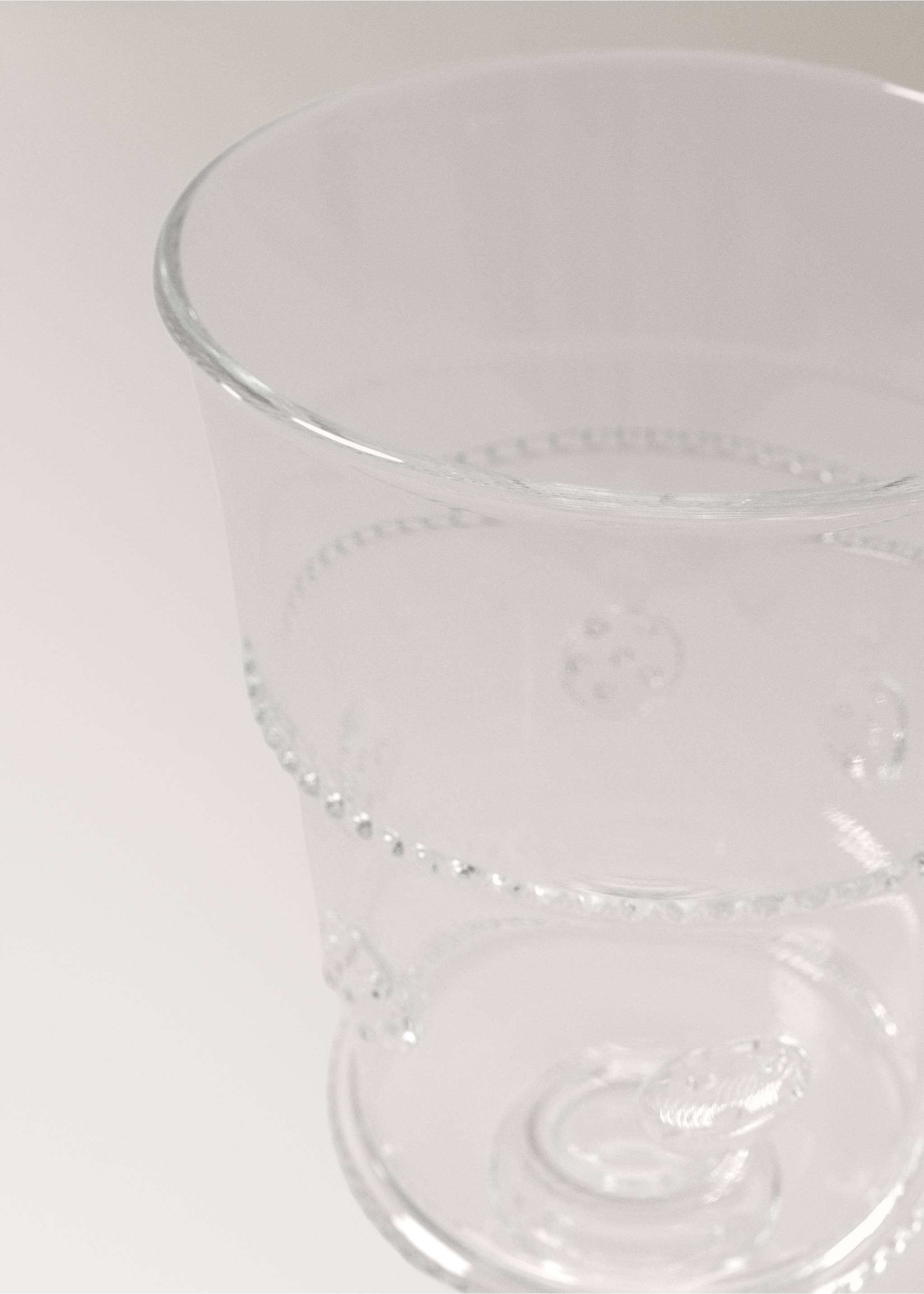 Průhledný pohár z borosilikátového skla s reliéfem - Detail zboží 1, Oranžová. Ref: 27092904-00.