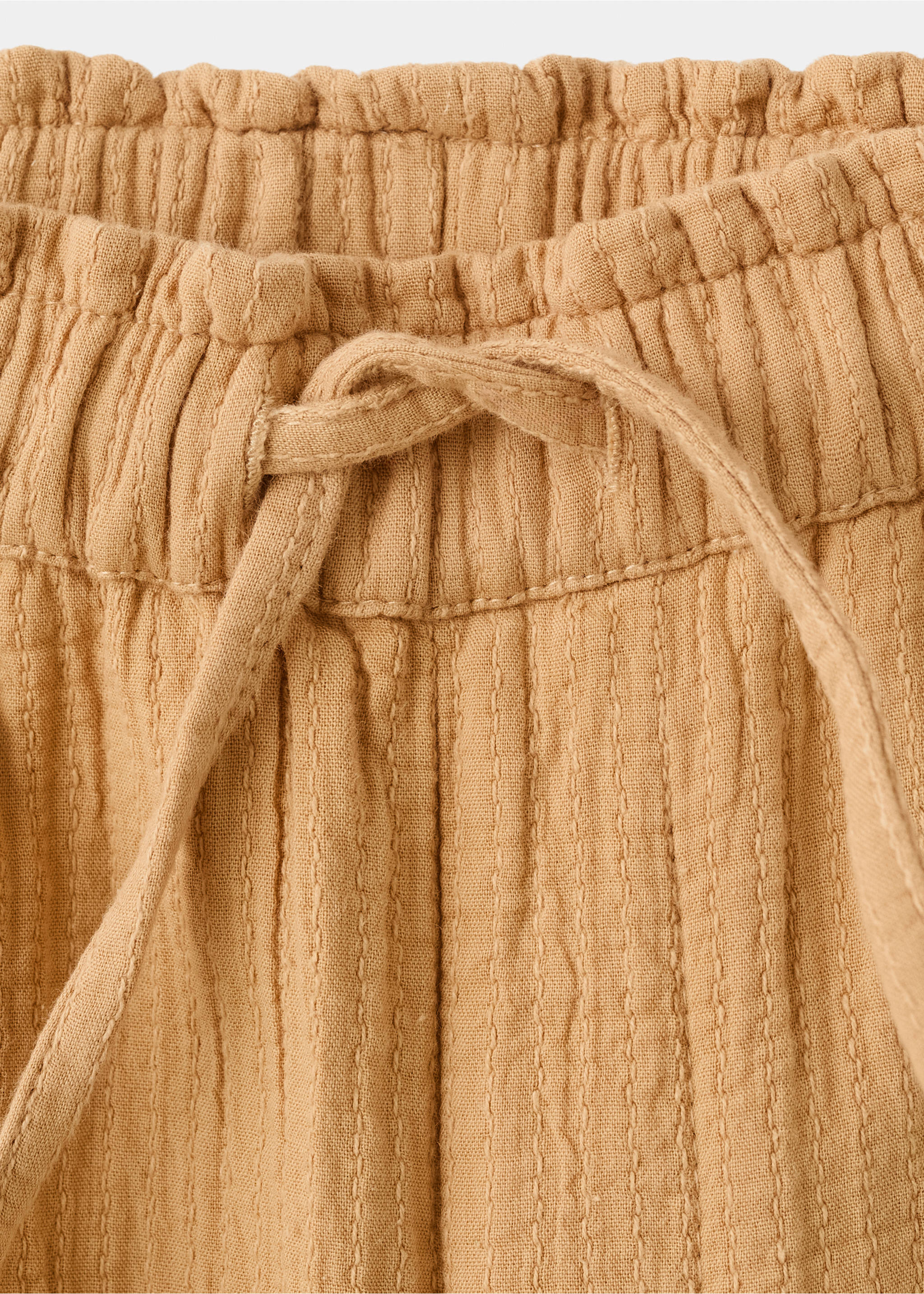 Textured embroidered pants - Details of the article 0, Mustard. Ref: 27094416-00.