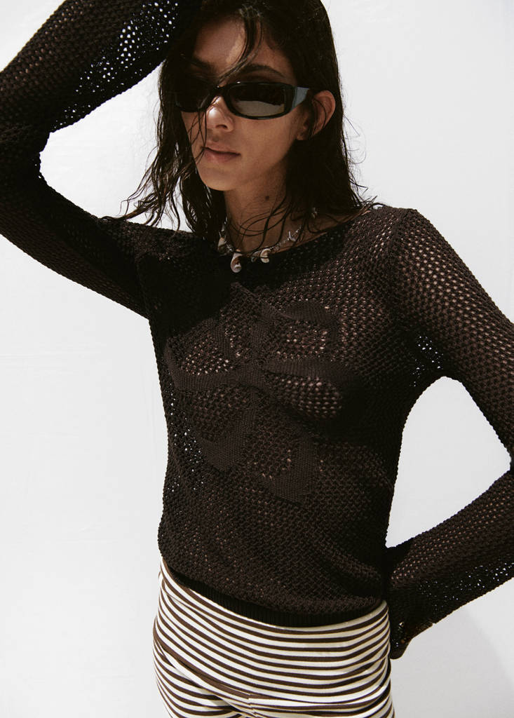 Crocheted sweater with floral embroidery
