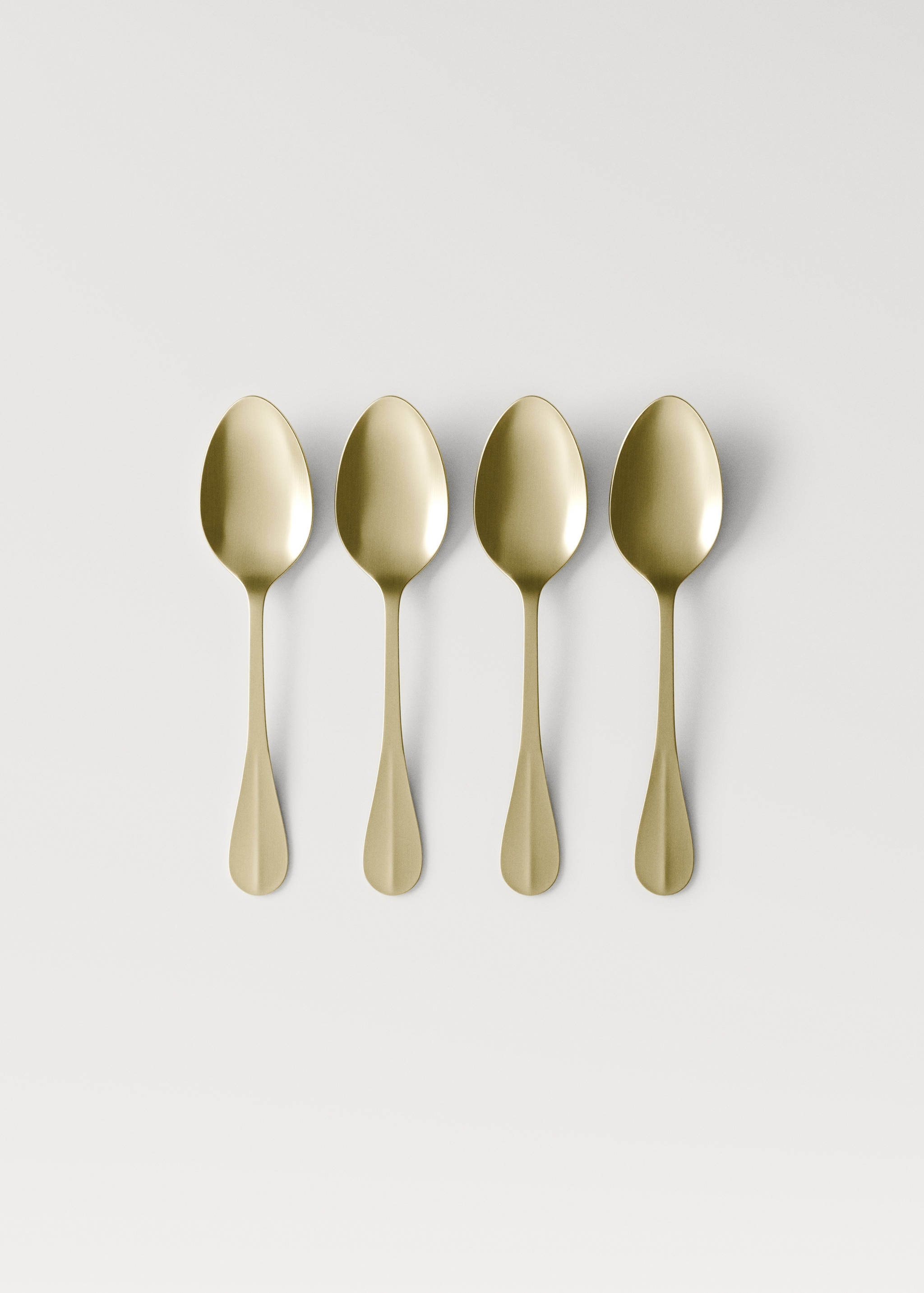Set of 4 stainless steel dessert spoons with gold finish - Article without model