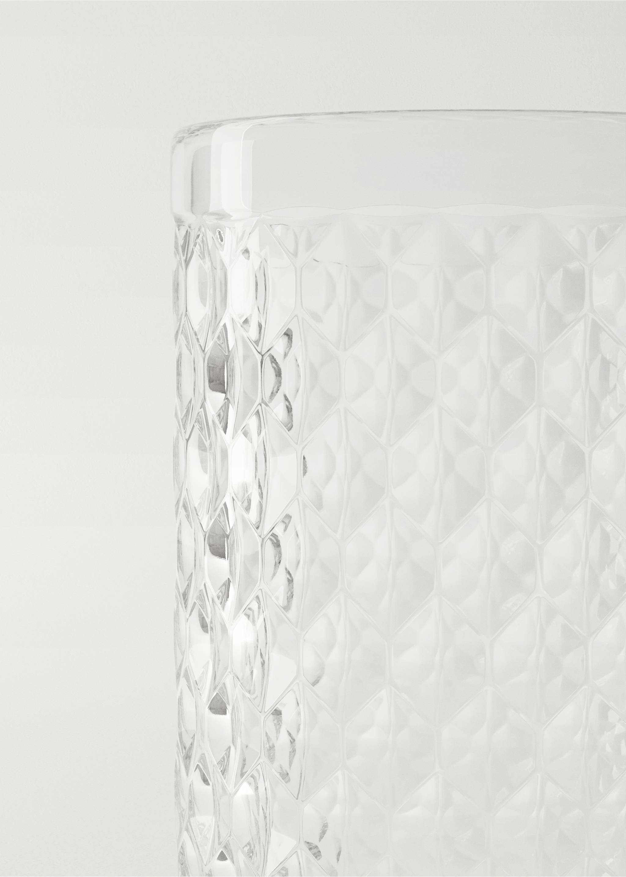 Close-up of a clear glass tumbler with a textured geometric pattern., Ice Grey. Ref: 27172938-00.