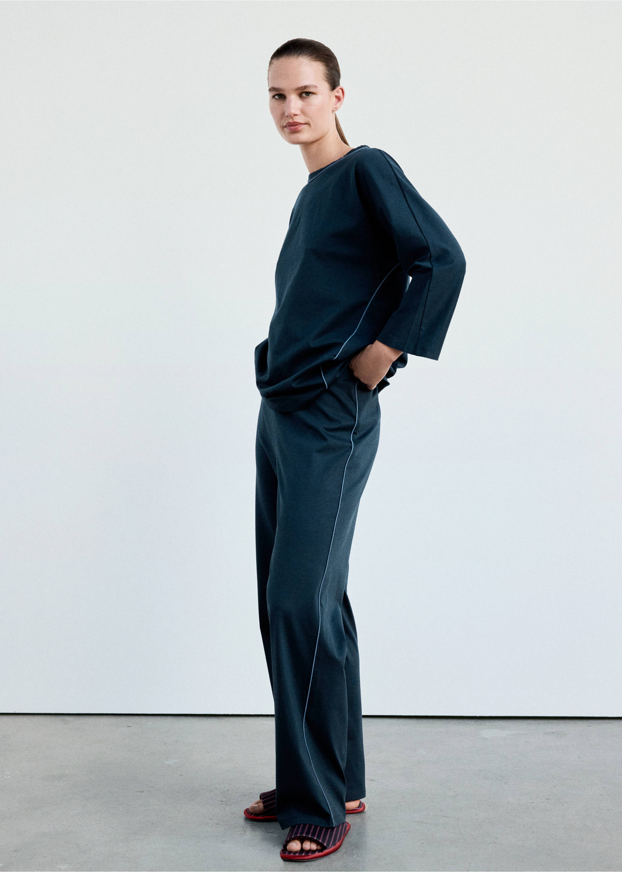 Dark teal pyjama trousers with white piping, worn with a matching top., Navy. Ref: 37002929-00.