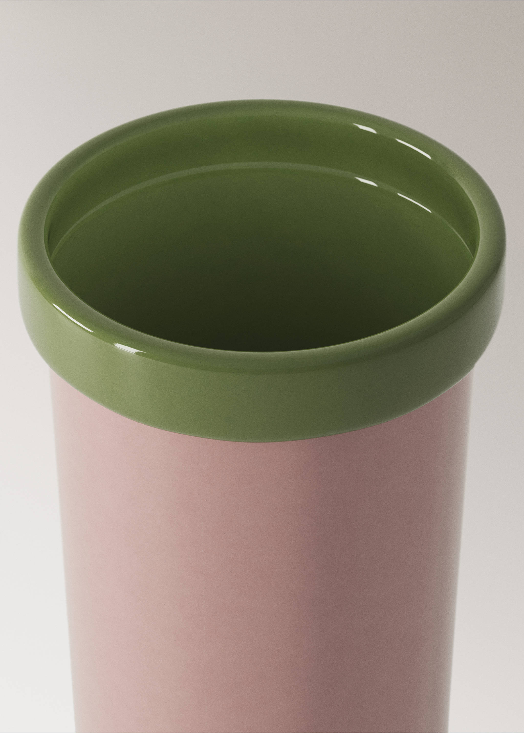 Pink ceramic vase detail with a glossy green rolled rim., Light/Pastel Purple. Ref: 37003286-00.