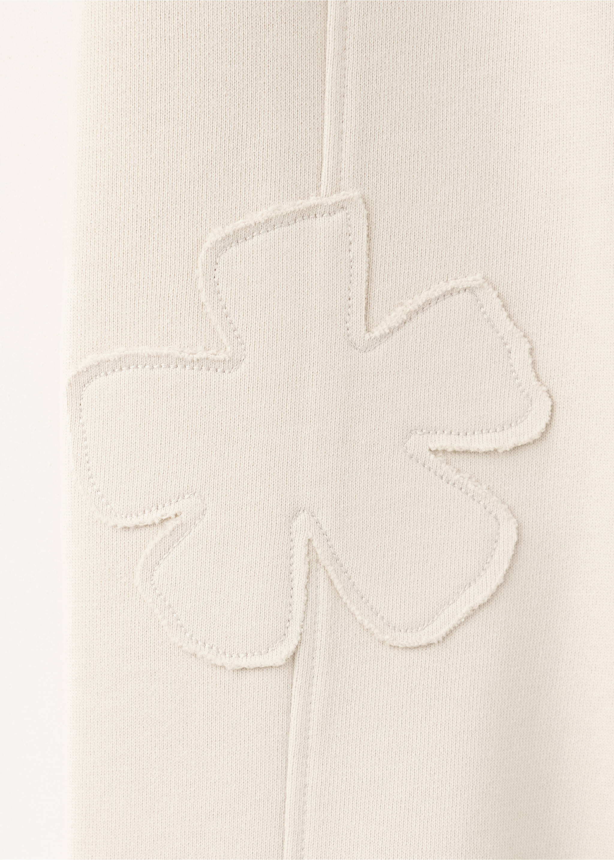 Pantalon jogger avec fleur brodée - Détail de l'article 8, Écru. Ref: 37004434-00.