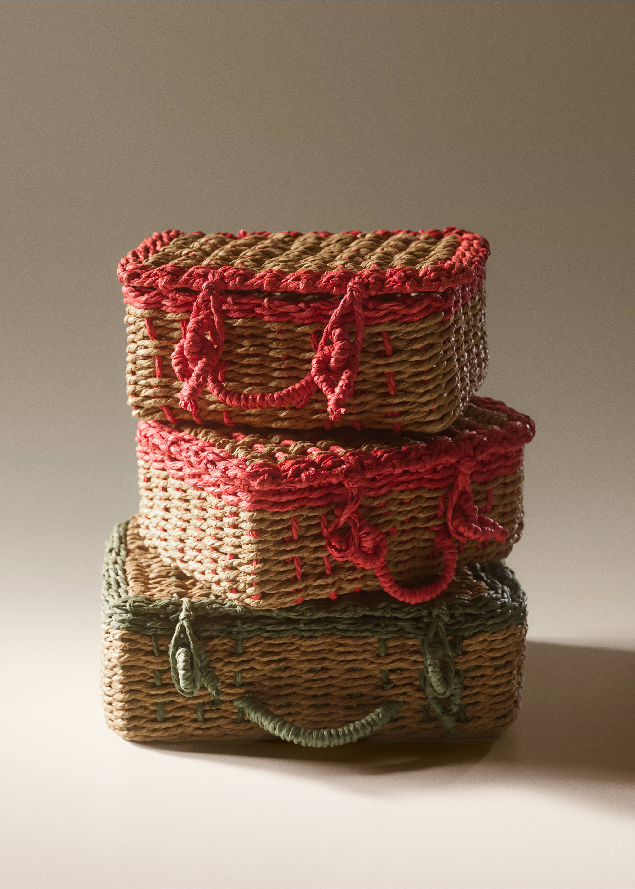 Stack of three woven basket suitcases with coloured trim and handles., Off White. Ref: 37004458-00.