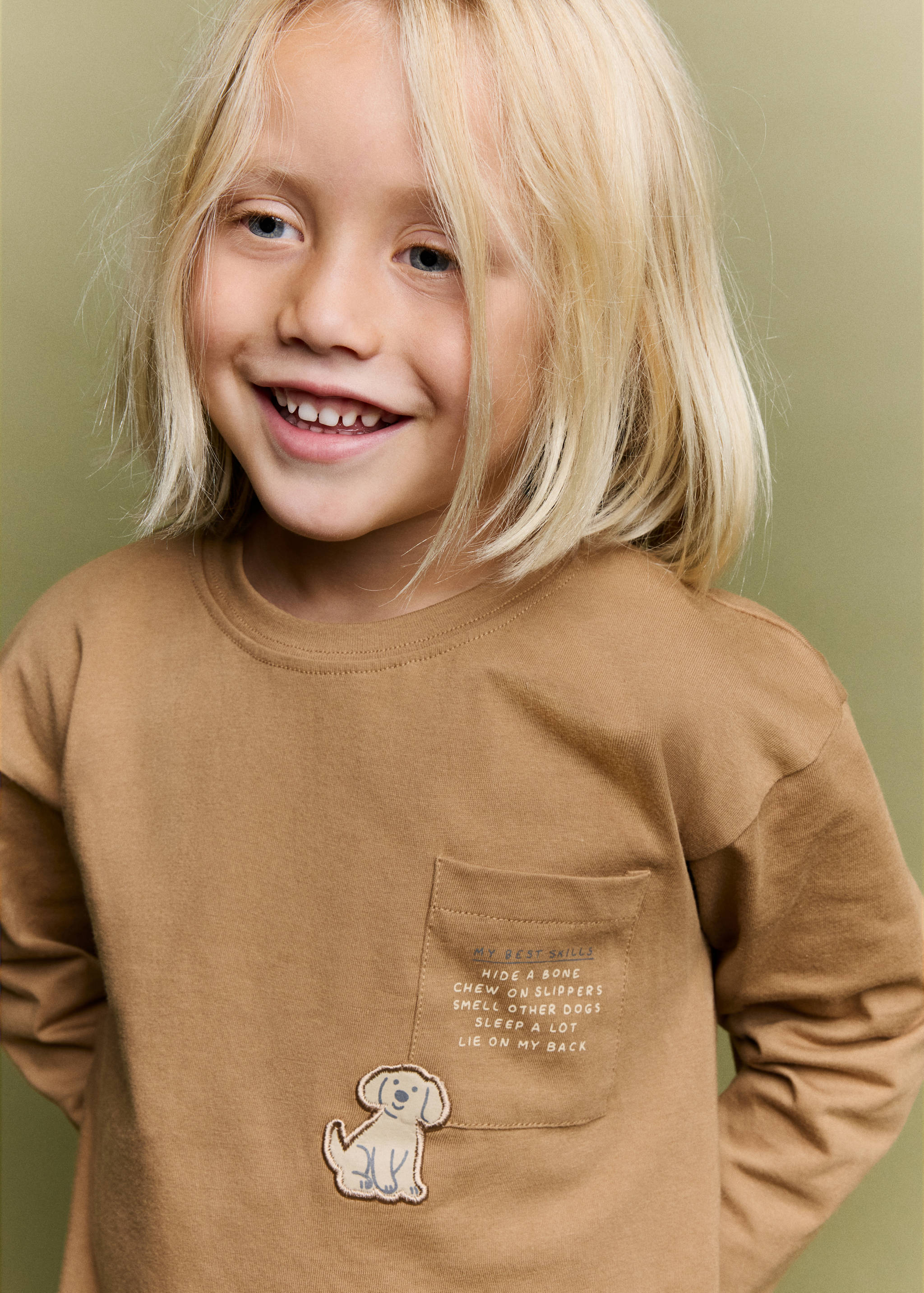 Brown long-sleeved t-shirt with a chest pocket and dog graphic.