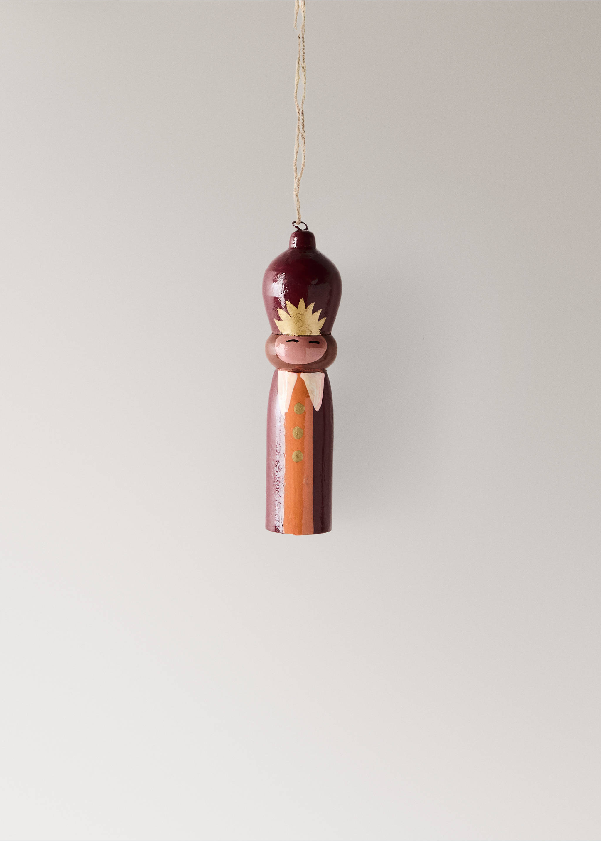 Burgundy wooden figurine Christmas ornament with a gold crown, white collar, and hanging twine., Red. Ref: 37006742-00.