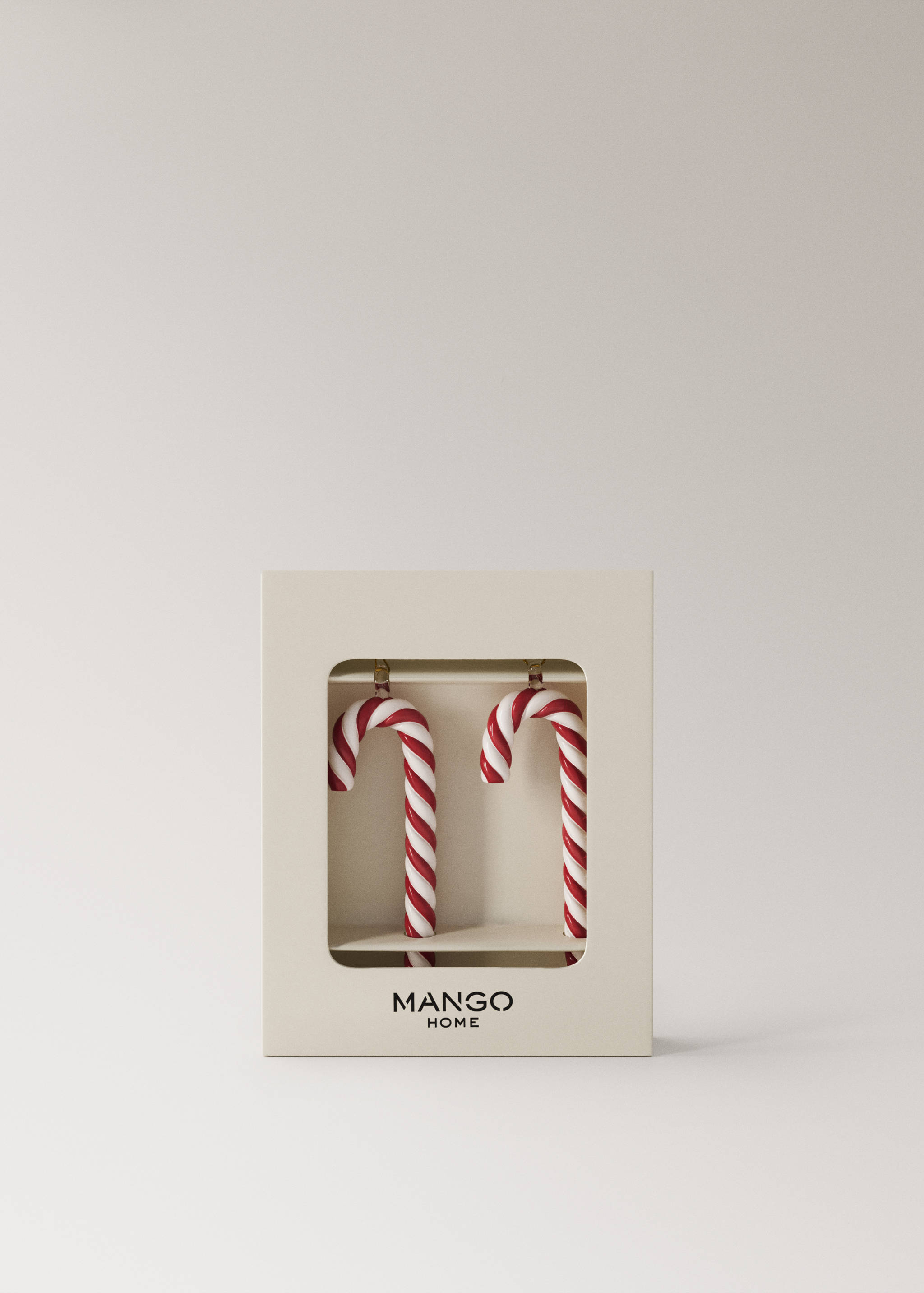 Red and white striped candy cane Christmas ornaments in a presentation box.