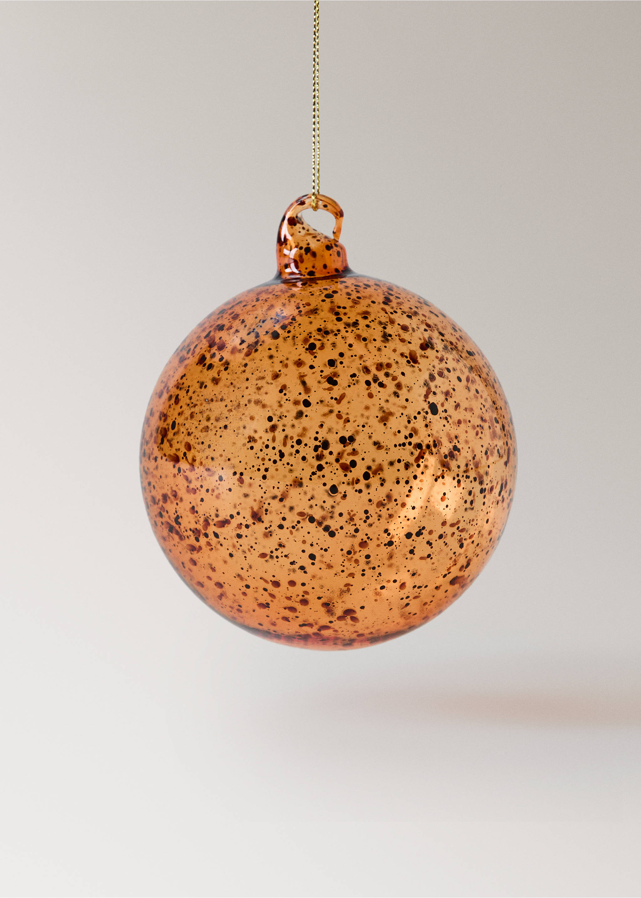 Amber glass Christmas ornament with a speckled tortoiseshell pattern and gold hanging string., Ochre. Ref: 37006745-00.