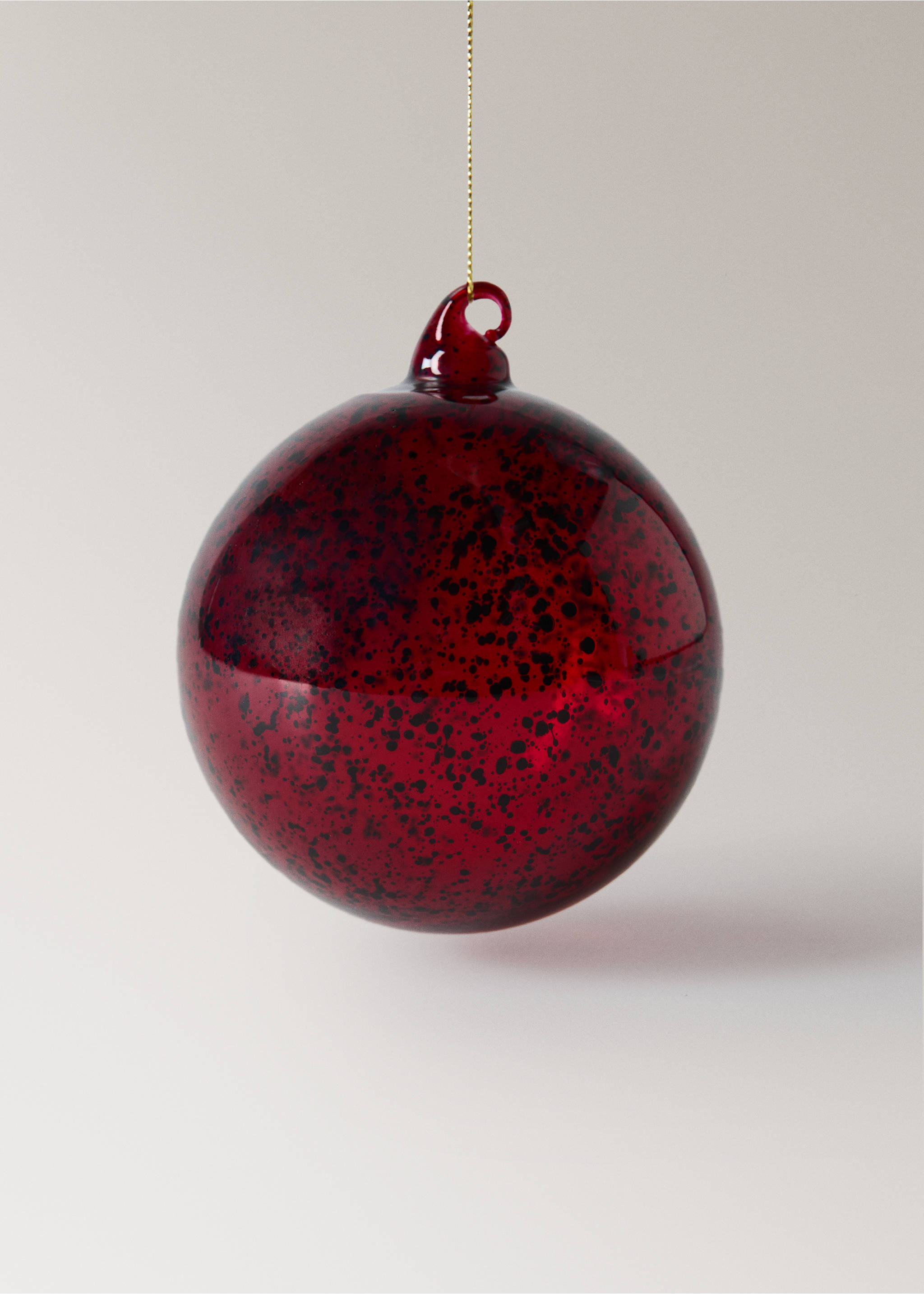 Red speckled glass Christmas decoration hanging from a gold string., Red. Ref: 37006745-00.