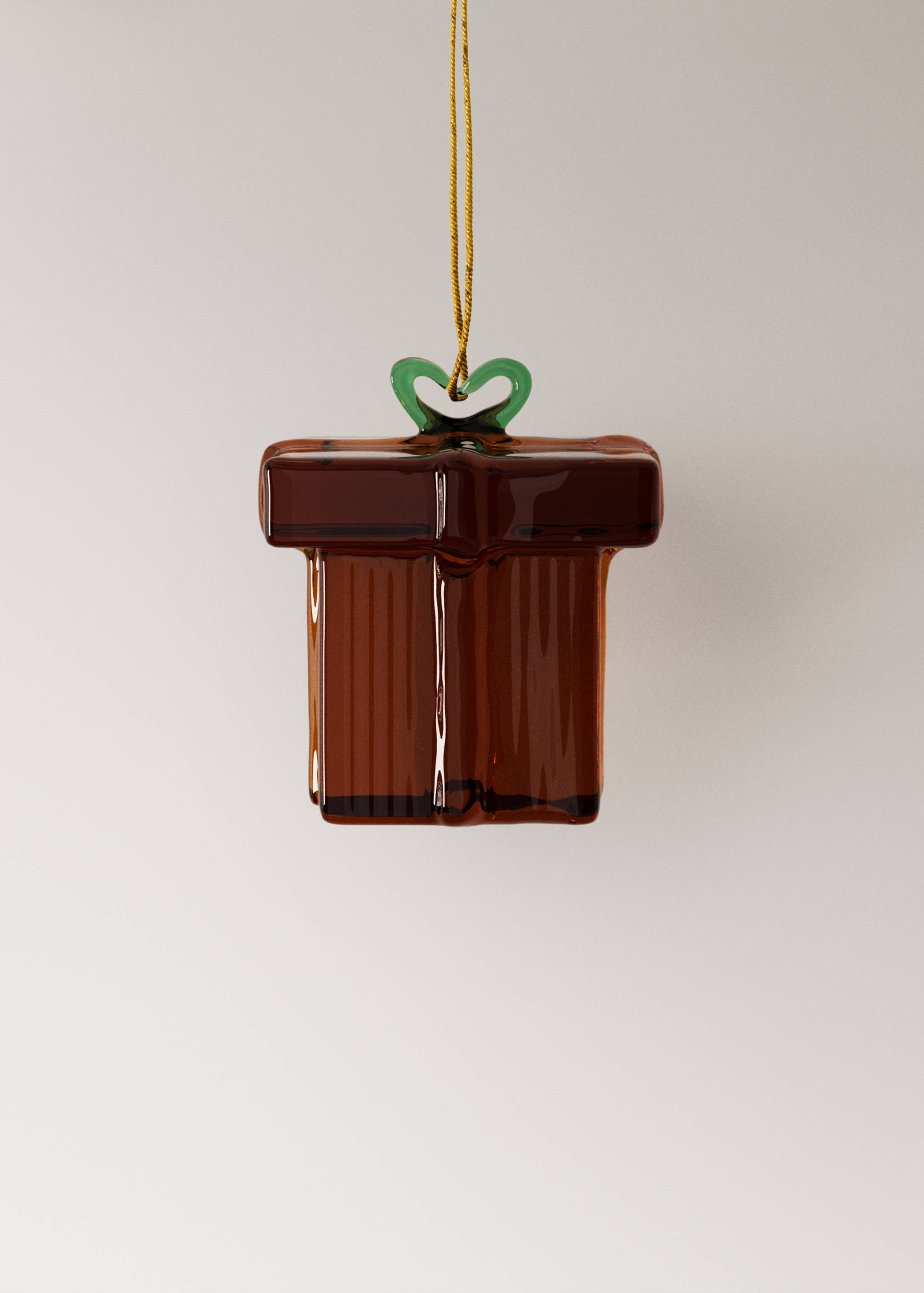 Two glass gift box Christmas ornaments in dark red with green bows and gold hanging cords.