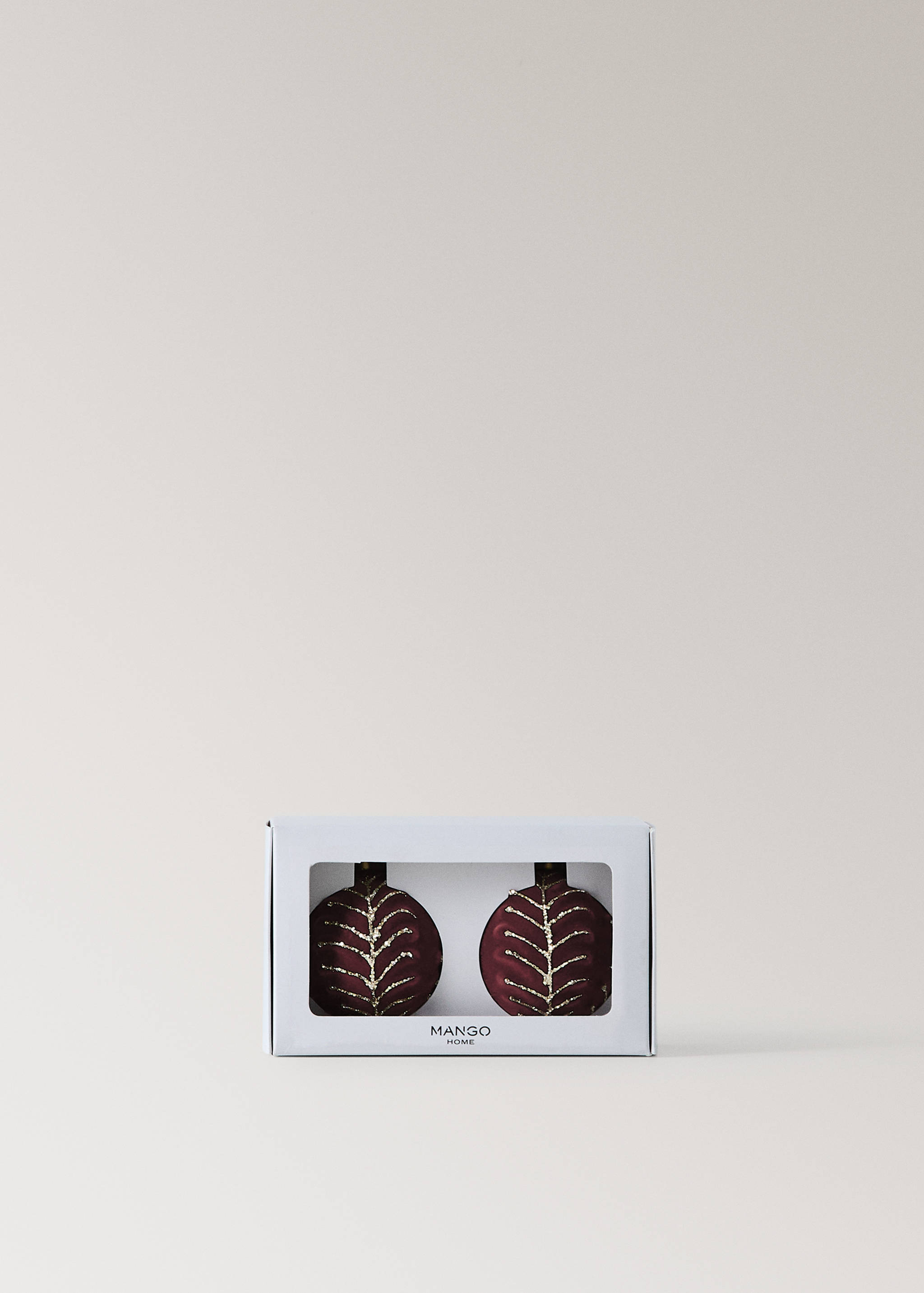 Set of two dark red glass Christmas ornaments with gold leaf pattern in a presentation box.