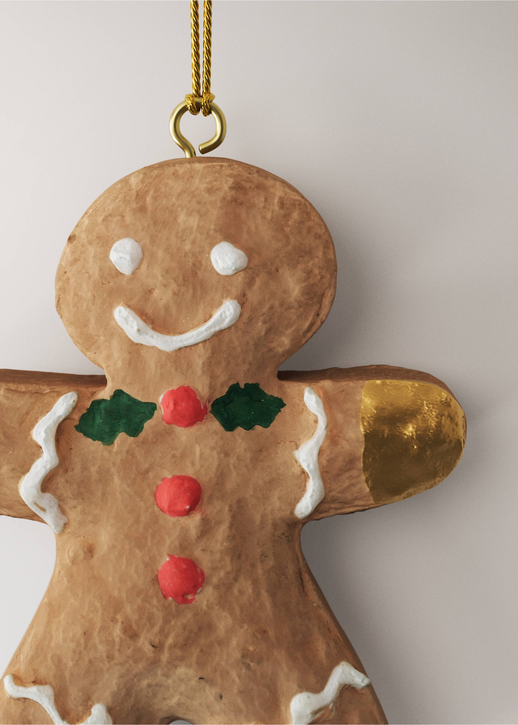 Textured gingerbread man Christmas ornament with painted white icing, red buttons, and gold details., Brown. Ref: 37006766-00.