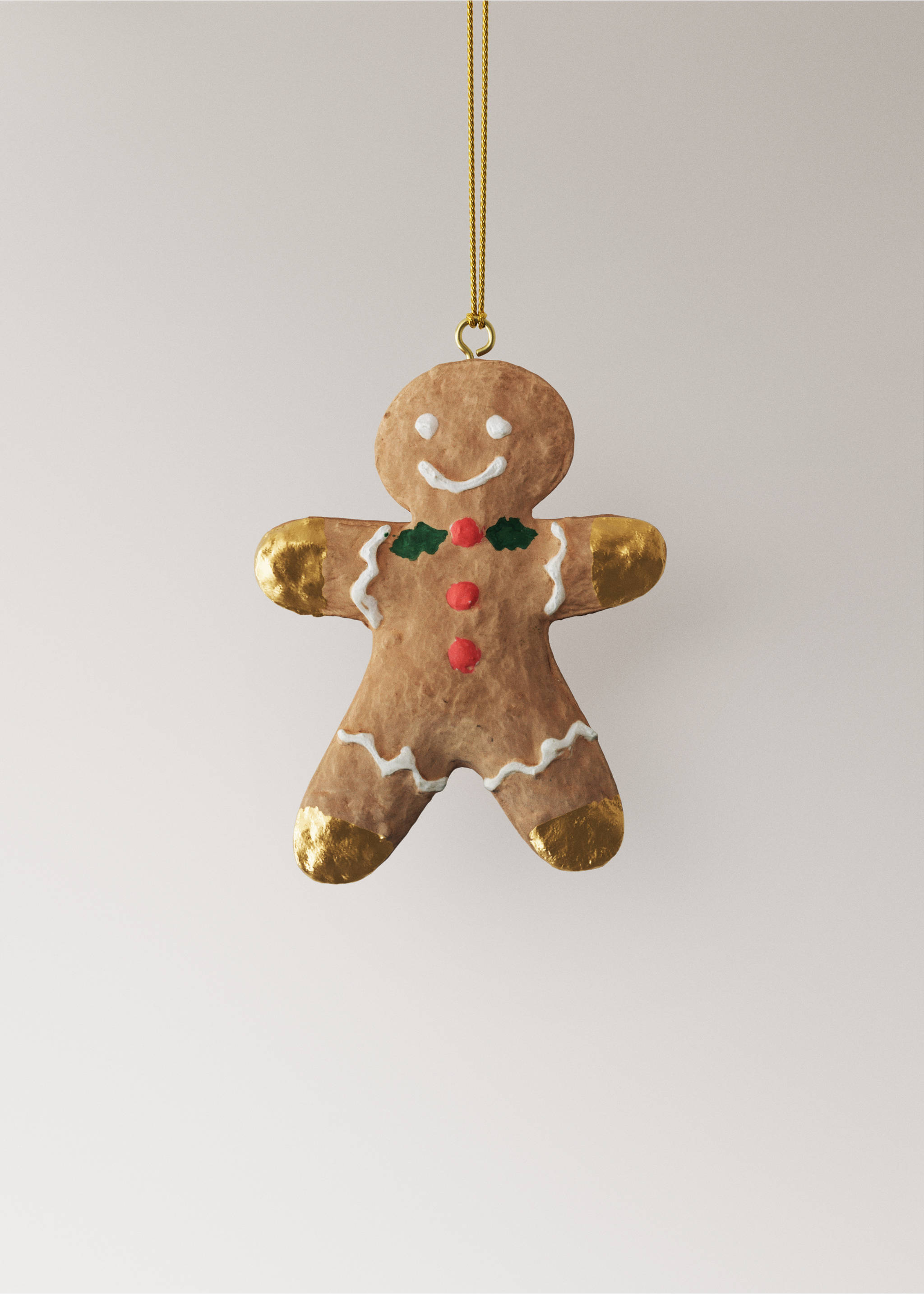 Brown textured gingerbread man Christmas ornament with painted icing and gold details, hanging on a gold string., Brown. Ref: 37006766-00.