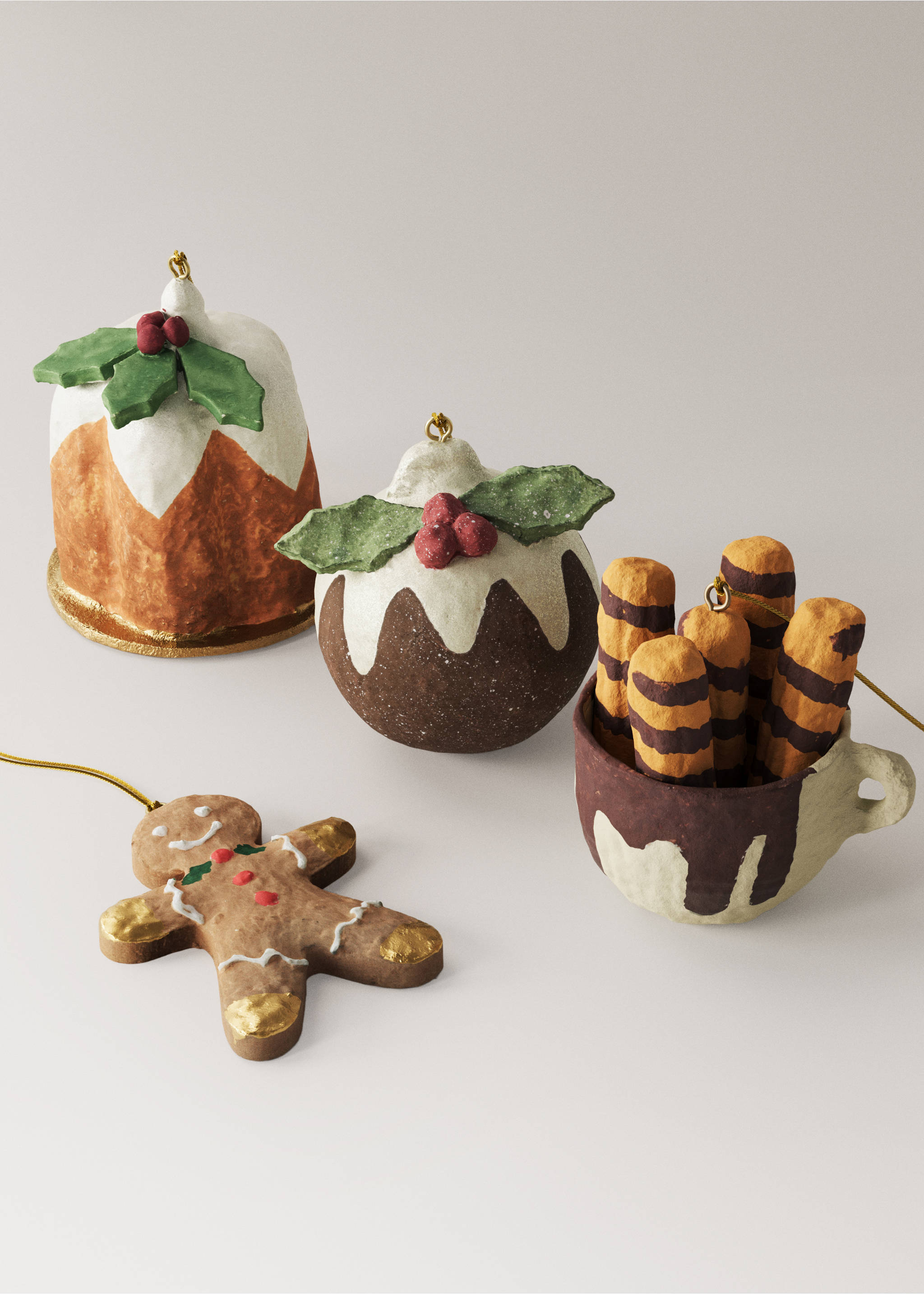 Christmas ornaments including puddings, a gingerbread man, and a mug with treats., Brown. Ref: 37006770-00.