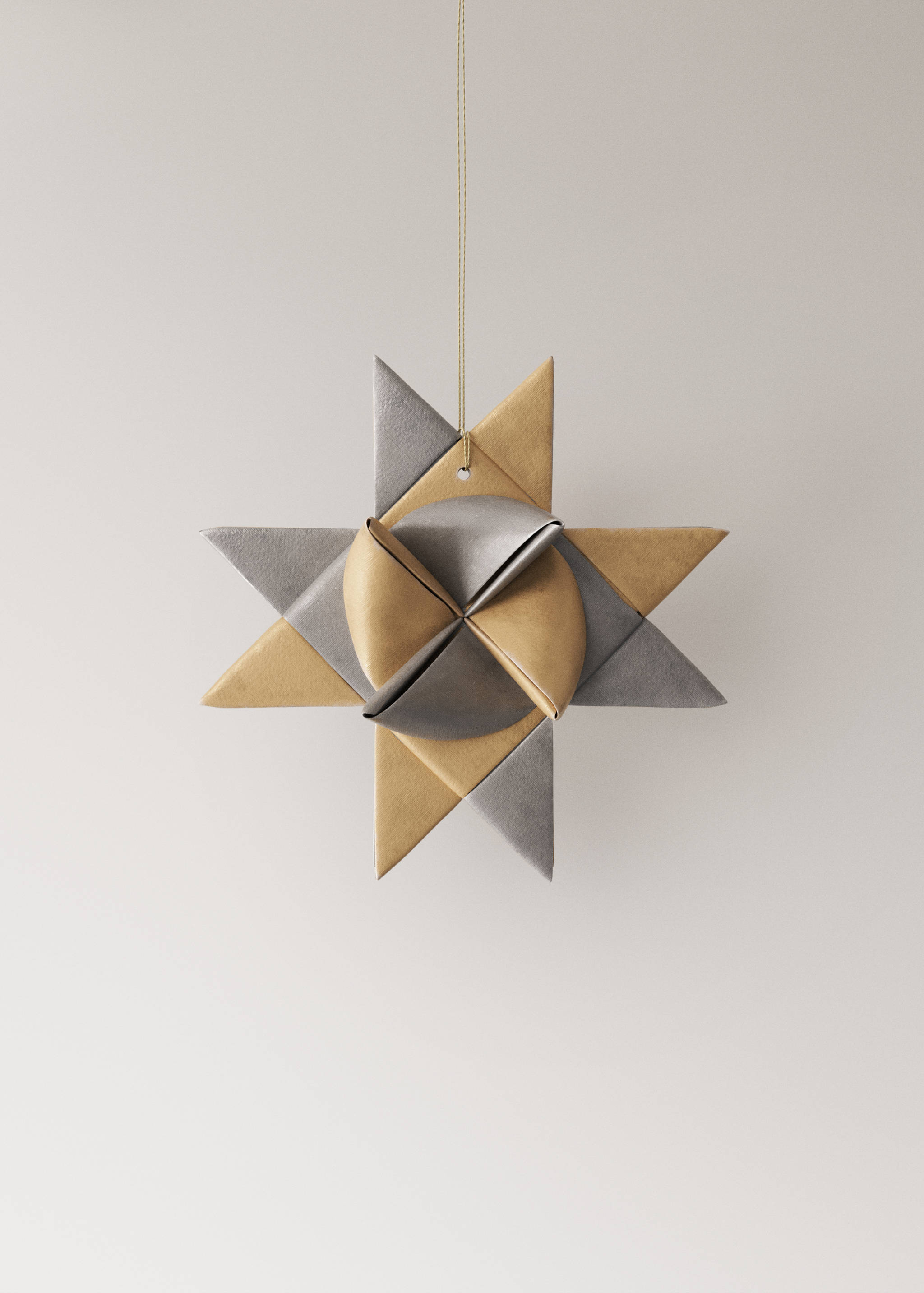 Two hanging gold and silver folded paper star ornaments.