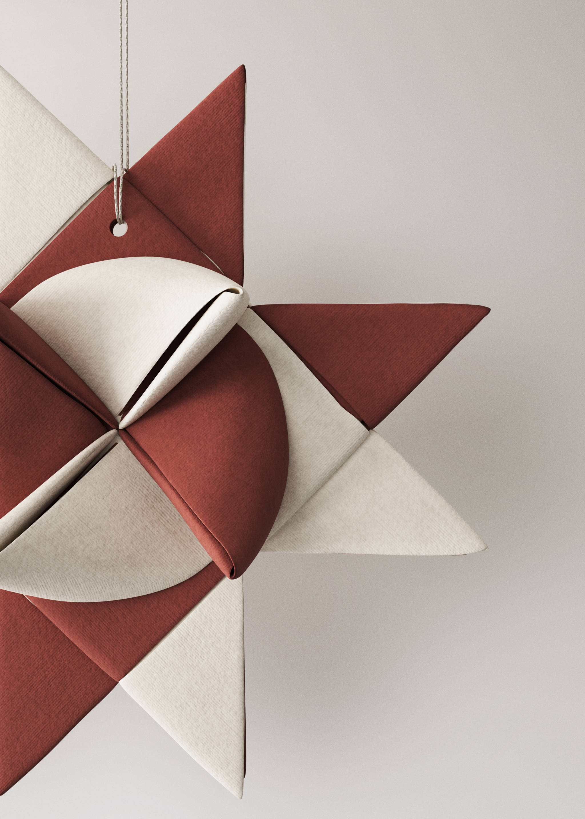 Burgundy and white geometric hanging star ornament.