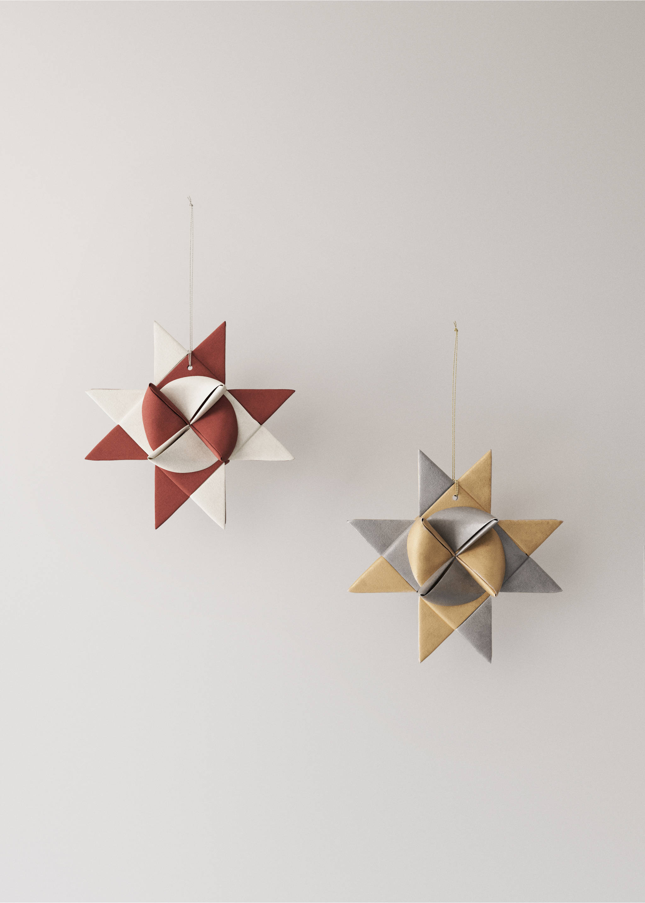 Two hanging Christmas star ornaments in cream, terracotta, gold and silver., Red. Ref: 37006773-00.