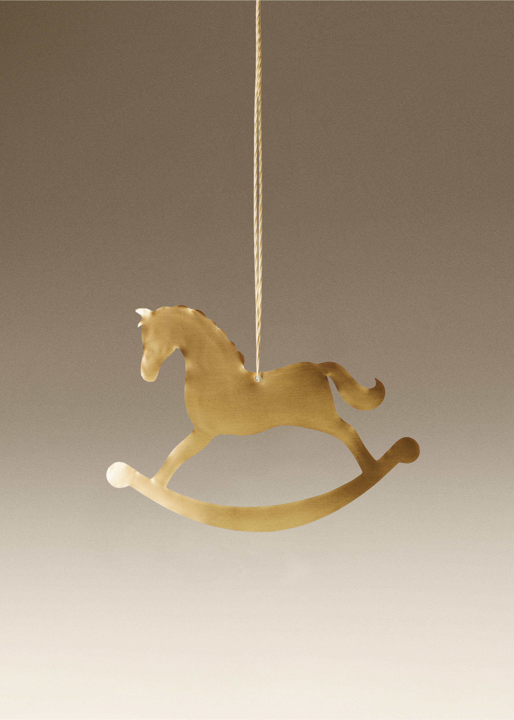 Gold-coloured metallic rocking horse Christmas ornament hanging by a twine string., Gold. Ref: 37006780-00.