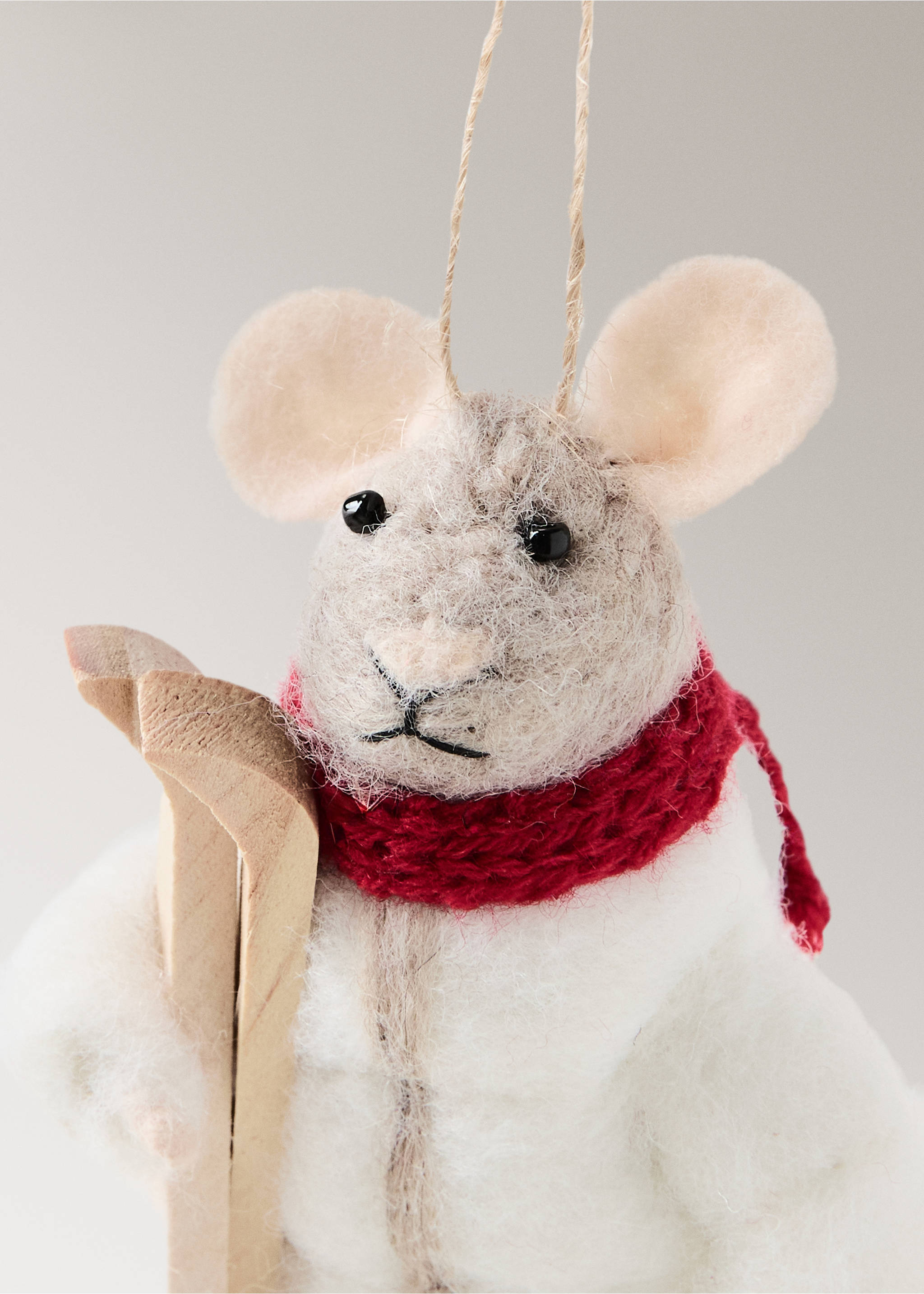 Felt Christmas mouse ornament wearing a red scarf and holding wooden skis., White. Ref: 37006792-00.