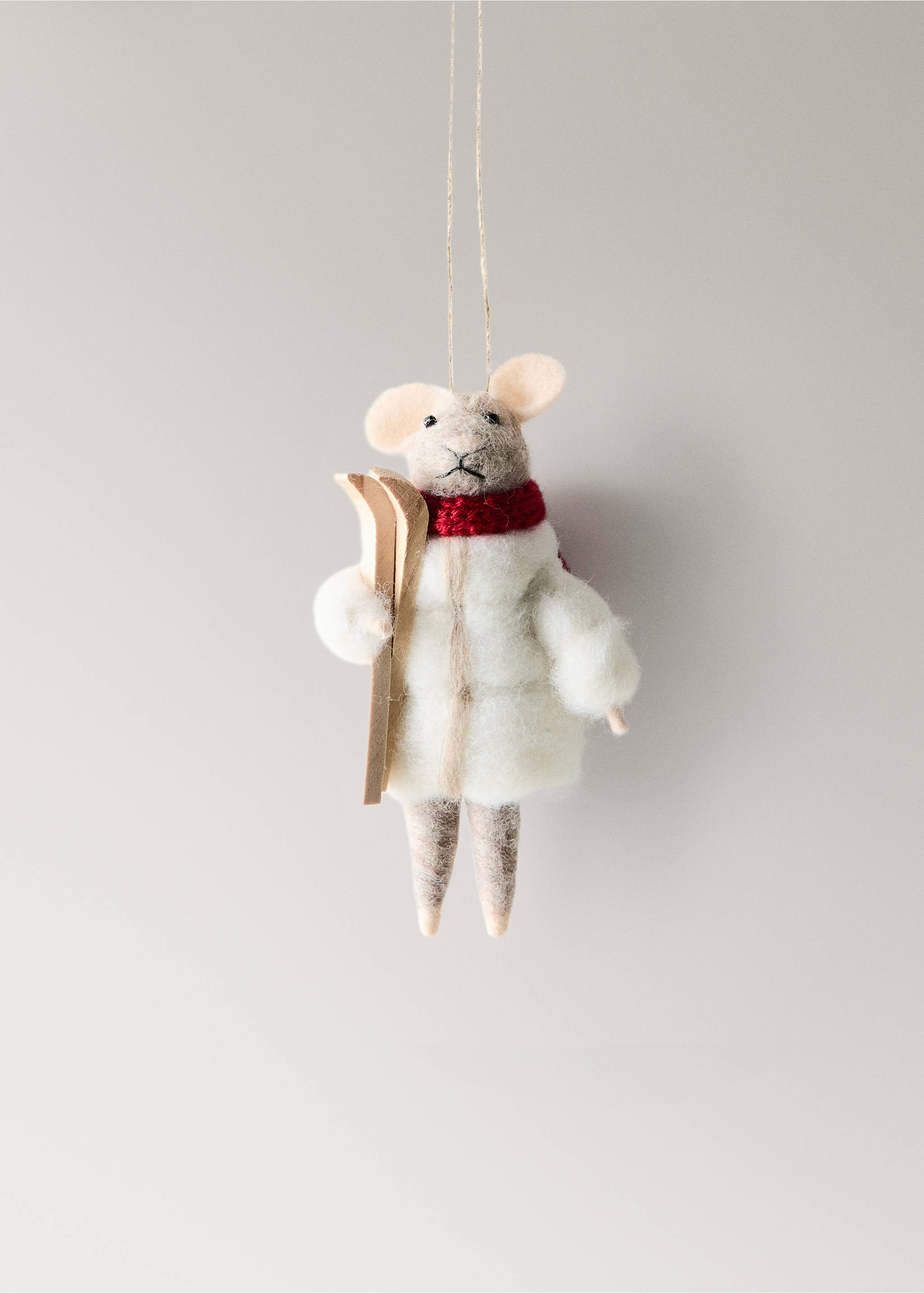 Felt mouse Christmas ornament wearing a white puffer jacket, red scarf, and holding wooden skis., White. Ref: 37006792-00.