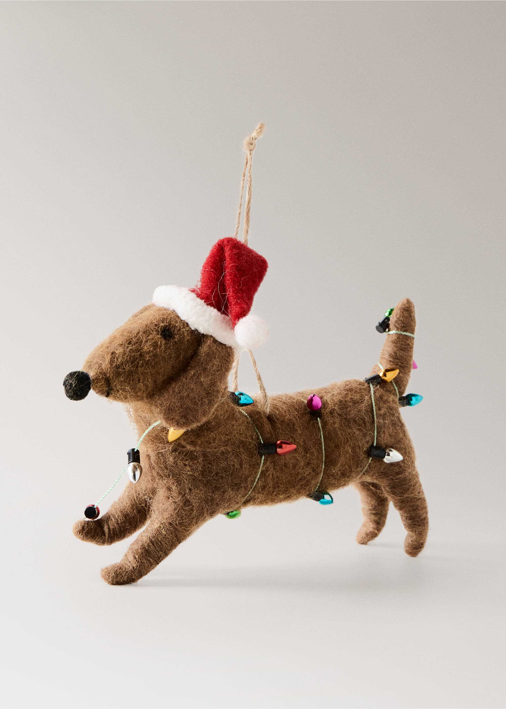Brown felt dachshund Christmas ornament wearing a Santa hat and wrapped in colourful lights., Brown. Ref: 37006793-00.