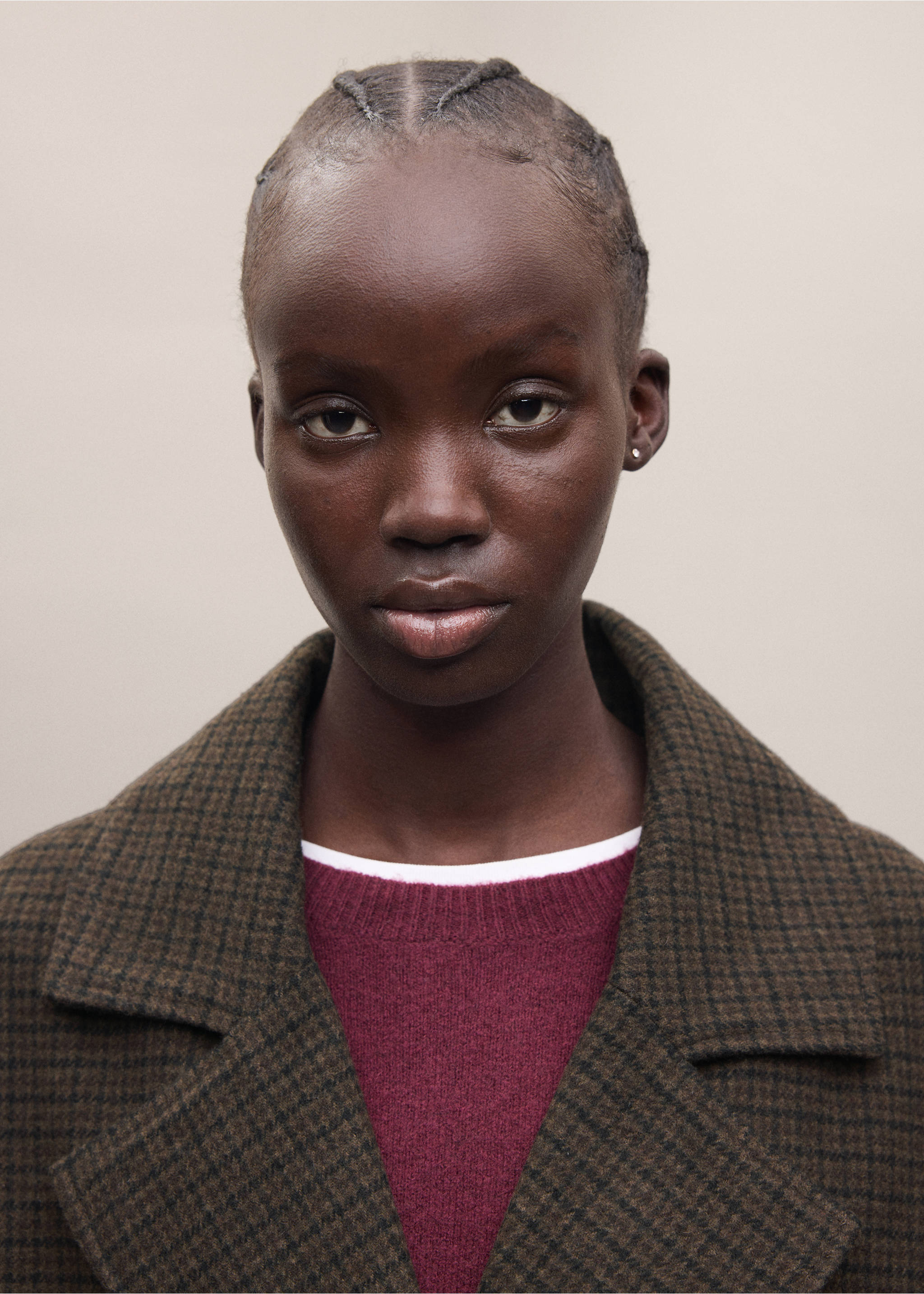 Close-up of a brown patterned coat with wide lapels, worn over a burgundy jumper., Chocolate. Ref: 37007121-01.