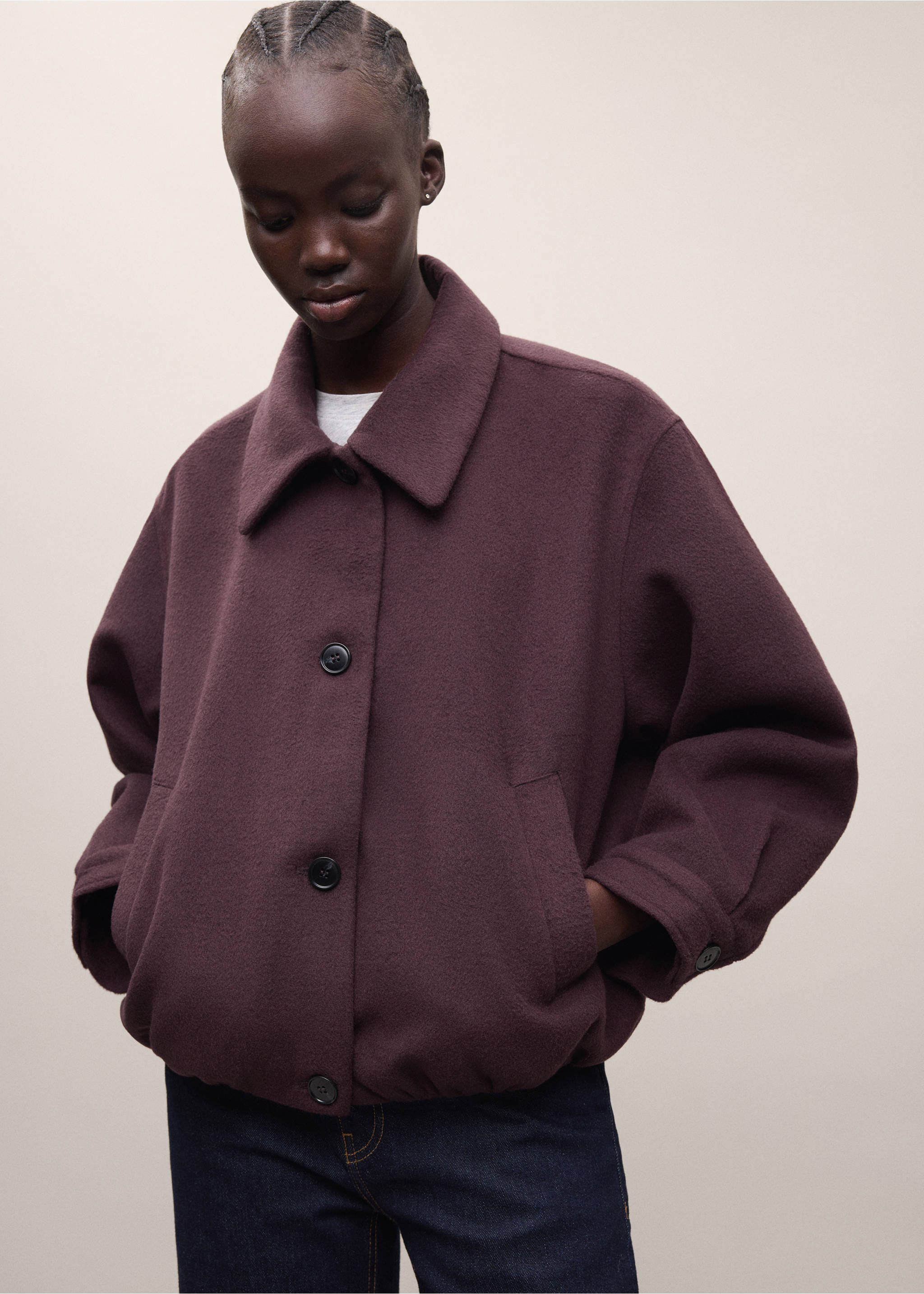 Dark plum coat with a pointed collar, front buttons, and relaxed fit., Maroon. Ref: 37007122-01.