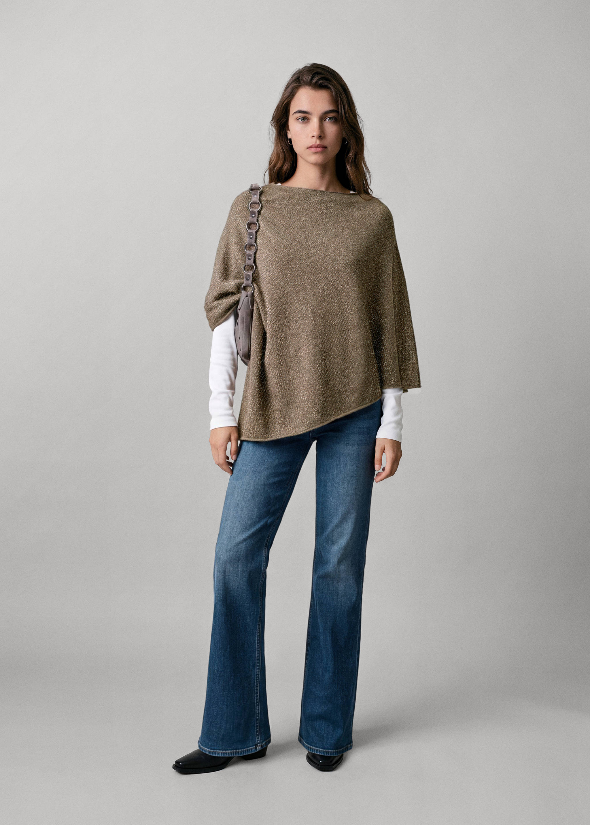 Metallic bronze-brown jersey with an asymmetric boat neckline and relaxed poncho-style silhouette.