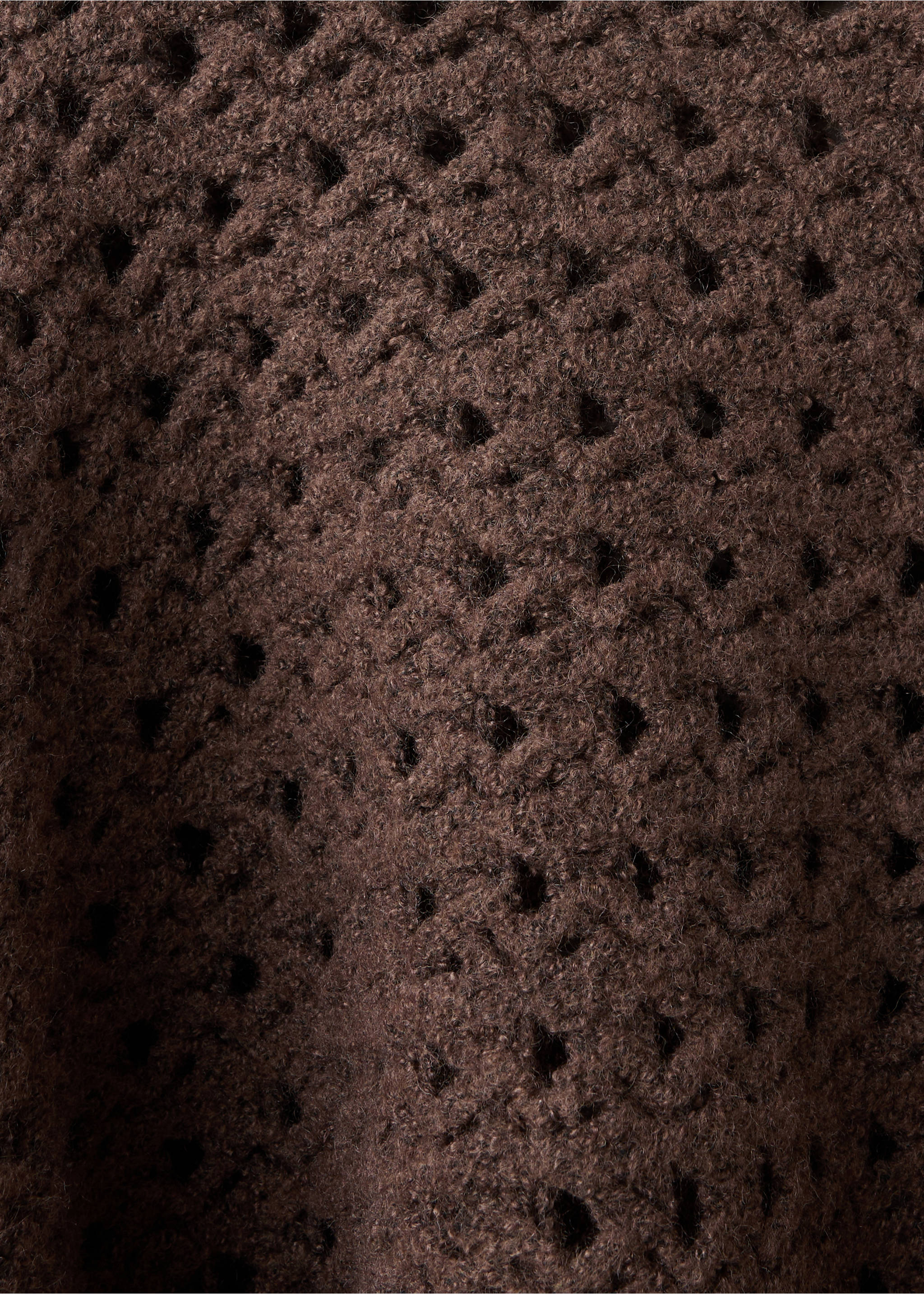 Close-up of the textured open-knit pattern on a dark brown jersey., Brown. Ref: 37007143-00.