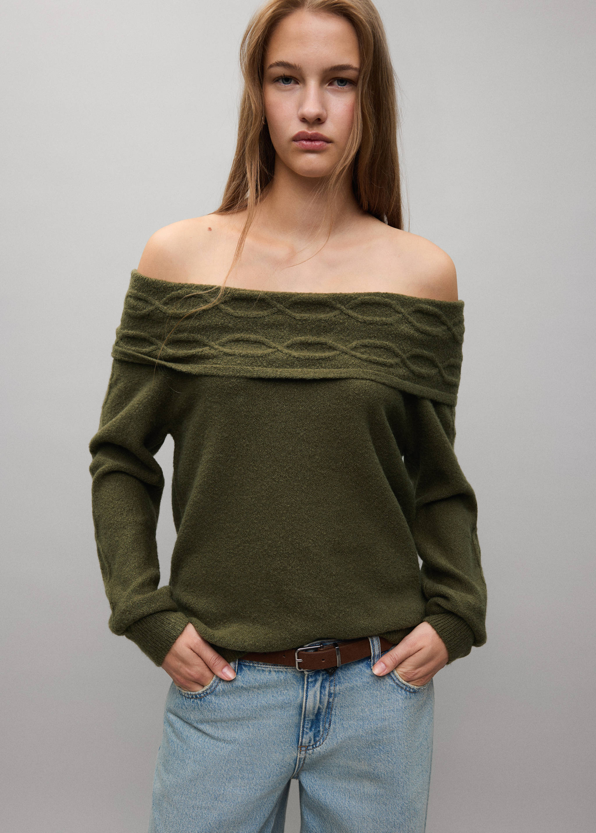 Olive green off-the-shoulder knitted jersey with a cable-knit collar band.