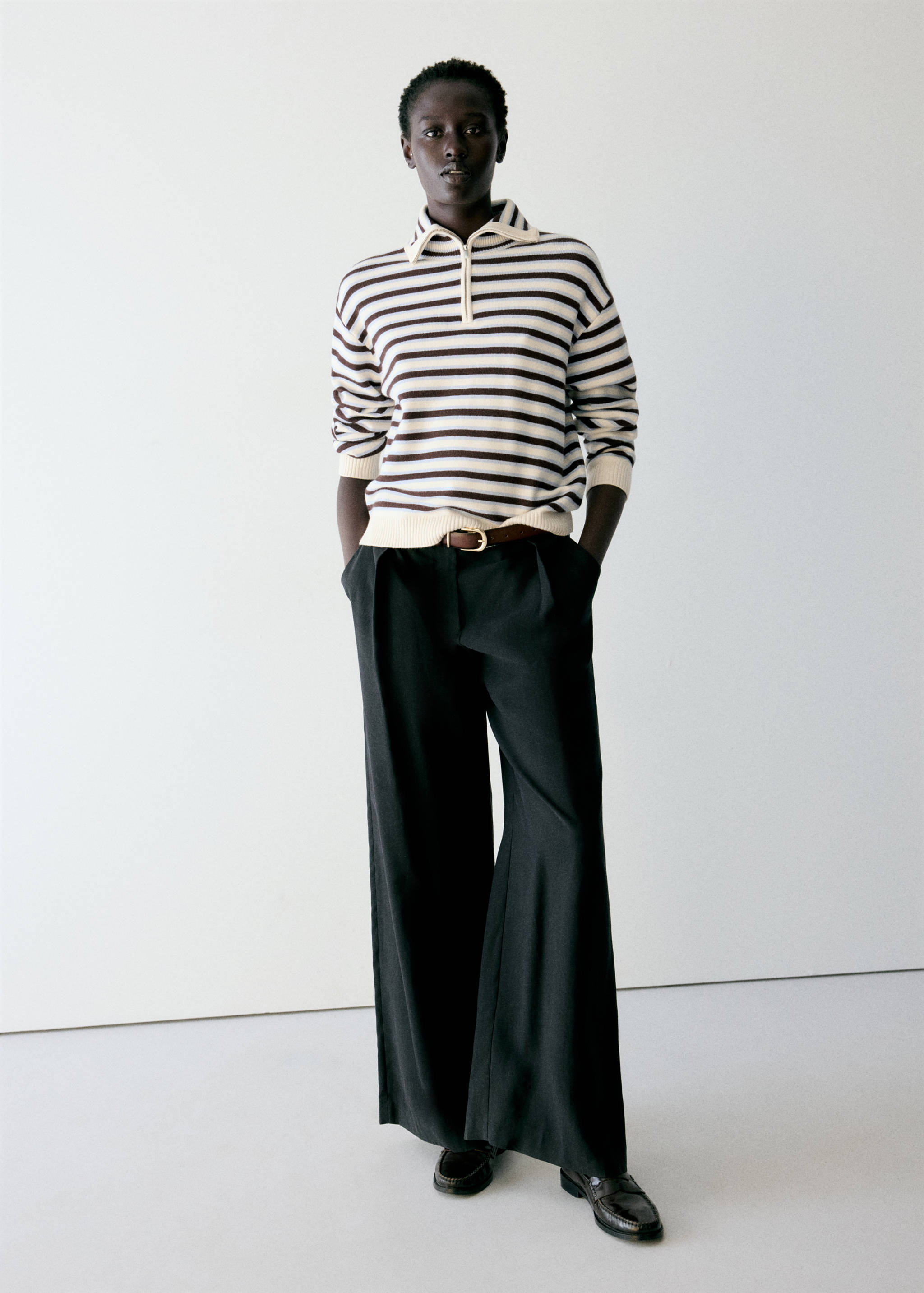 Brown and off-white striped knit jersey with a polo collar and short zip.