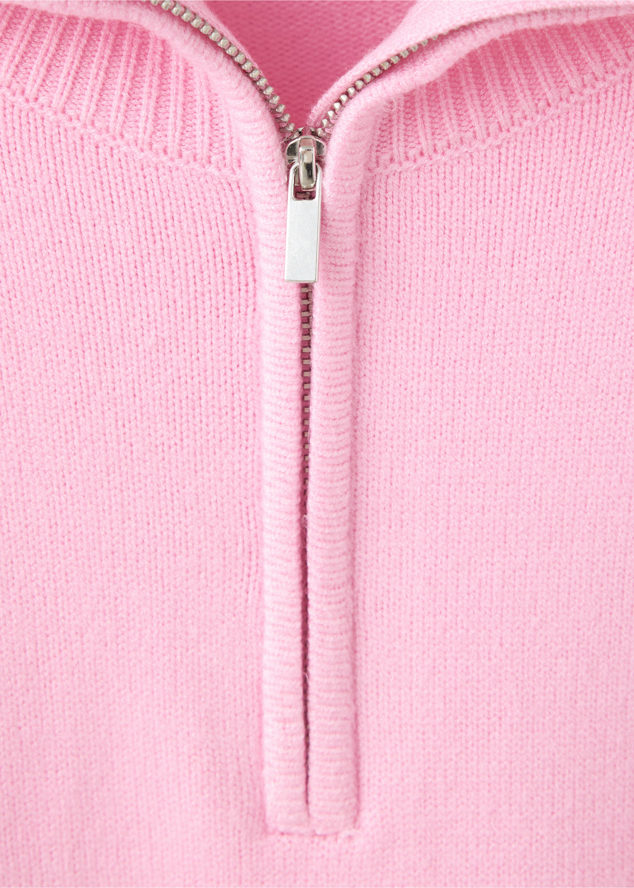 Close-up of a pink knit jersey featuring a silver-toned zip neckline and ribbed collar., Light Pink. Ref: 37007784-00.