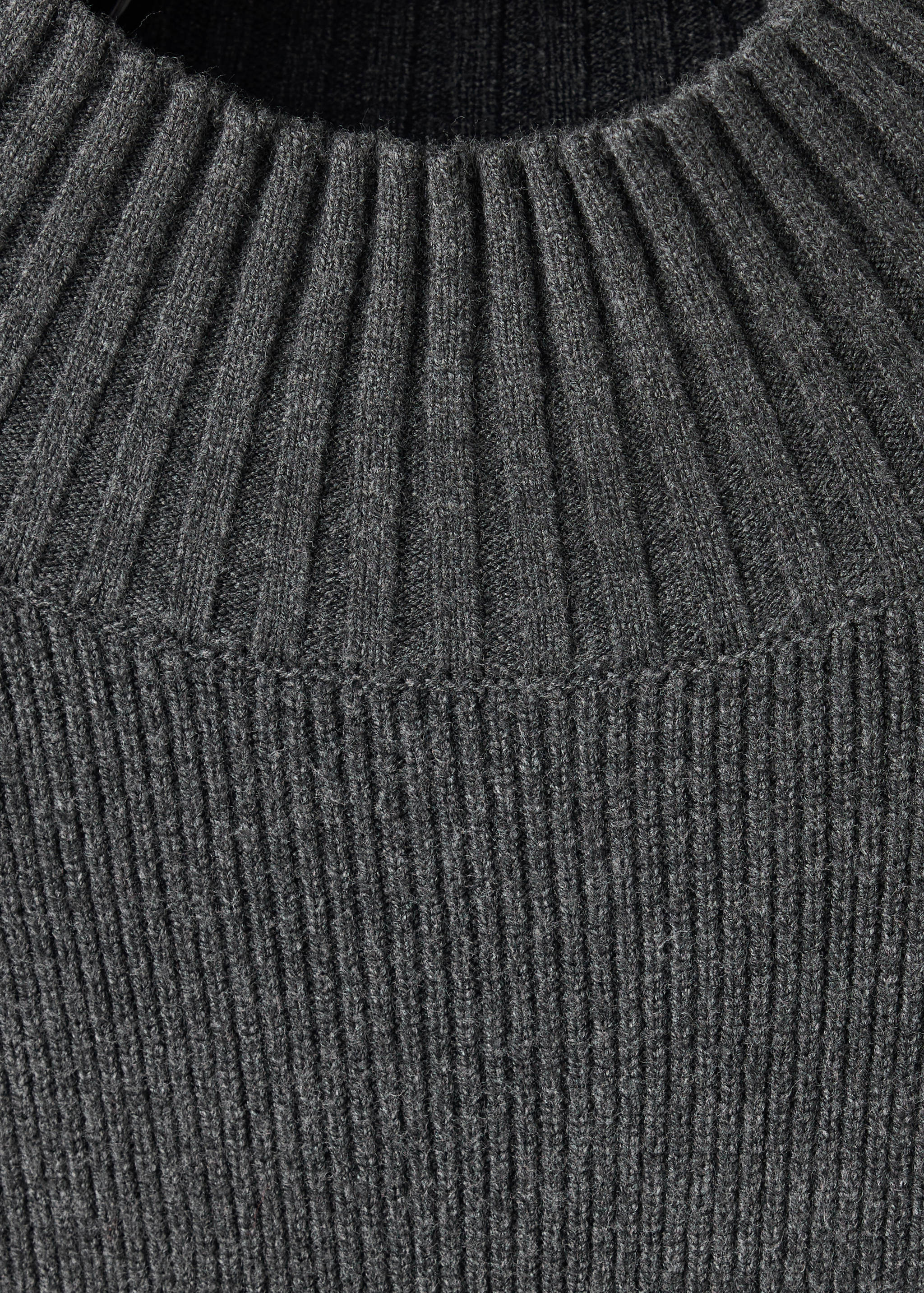 Dark grey knitted jersey with a ribbed round neckline.