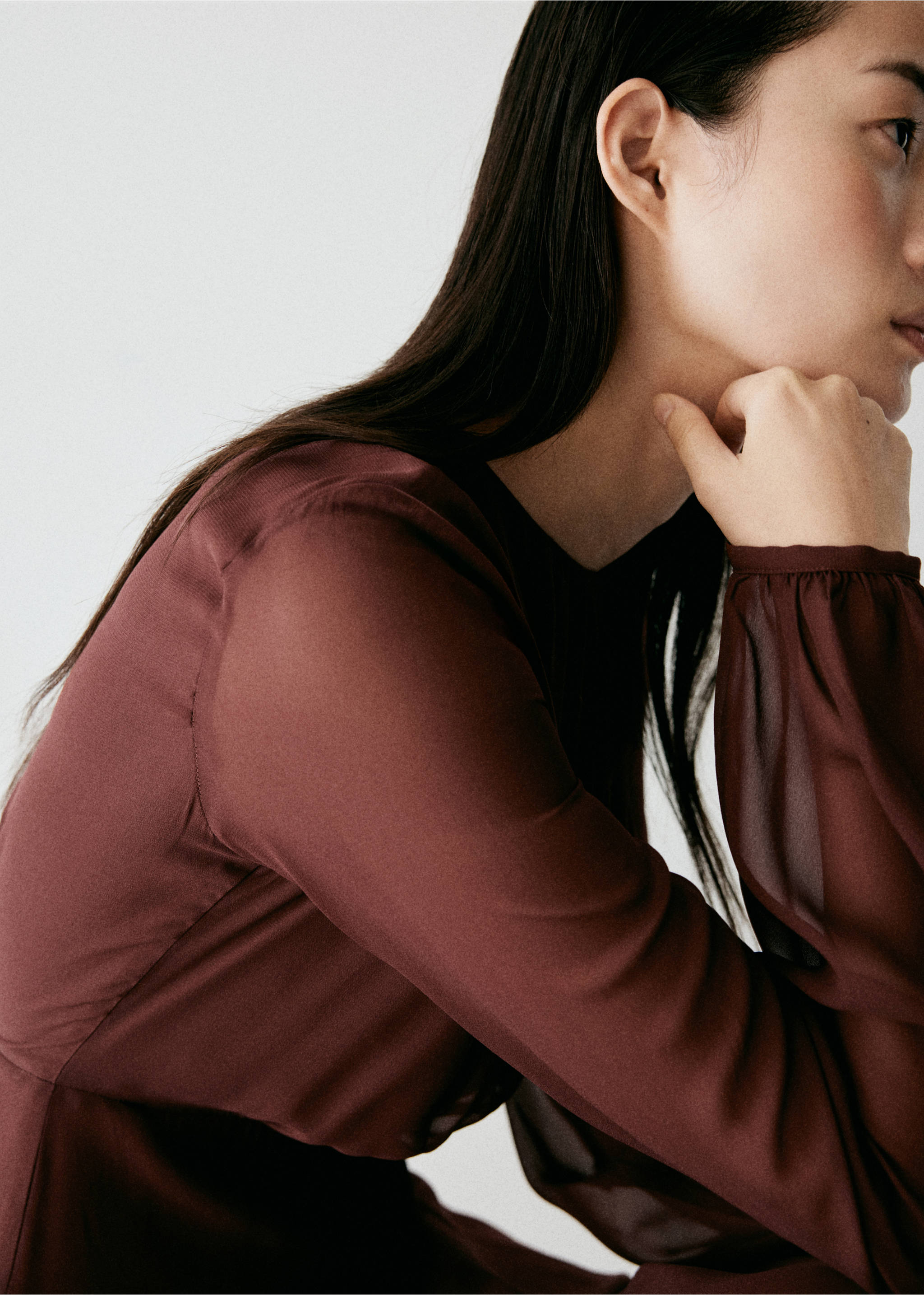 Close-up of a burgundy semi-sheer dress with long sleeves., Cherry. Ref: 37007787-00.