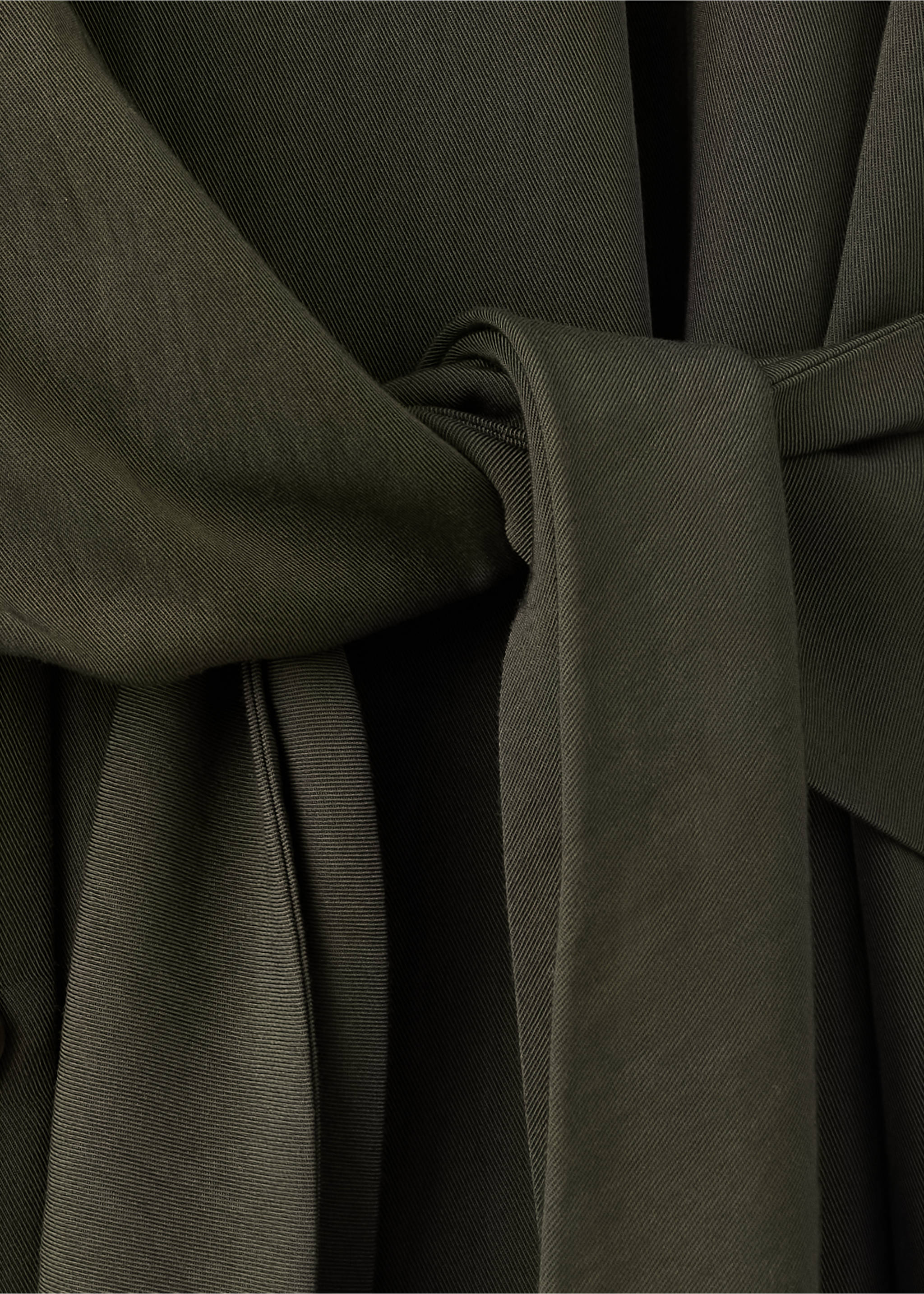 Close-up of an olive green dress with a tied fabric belt., Green. Ref: 37007793-00.