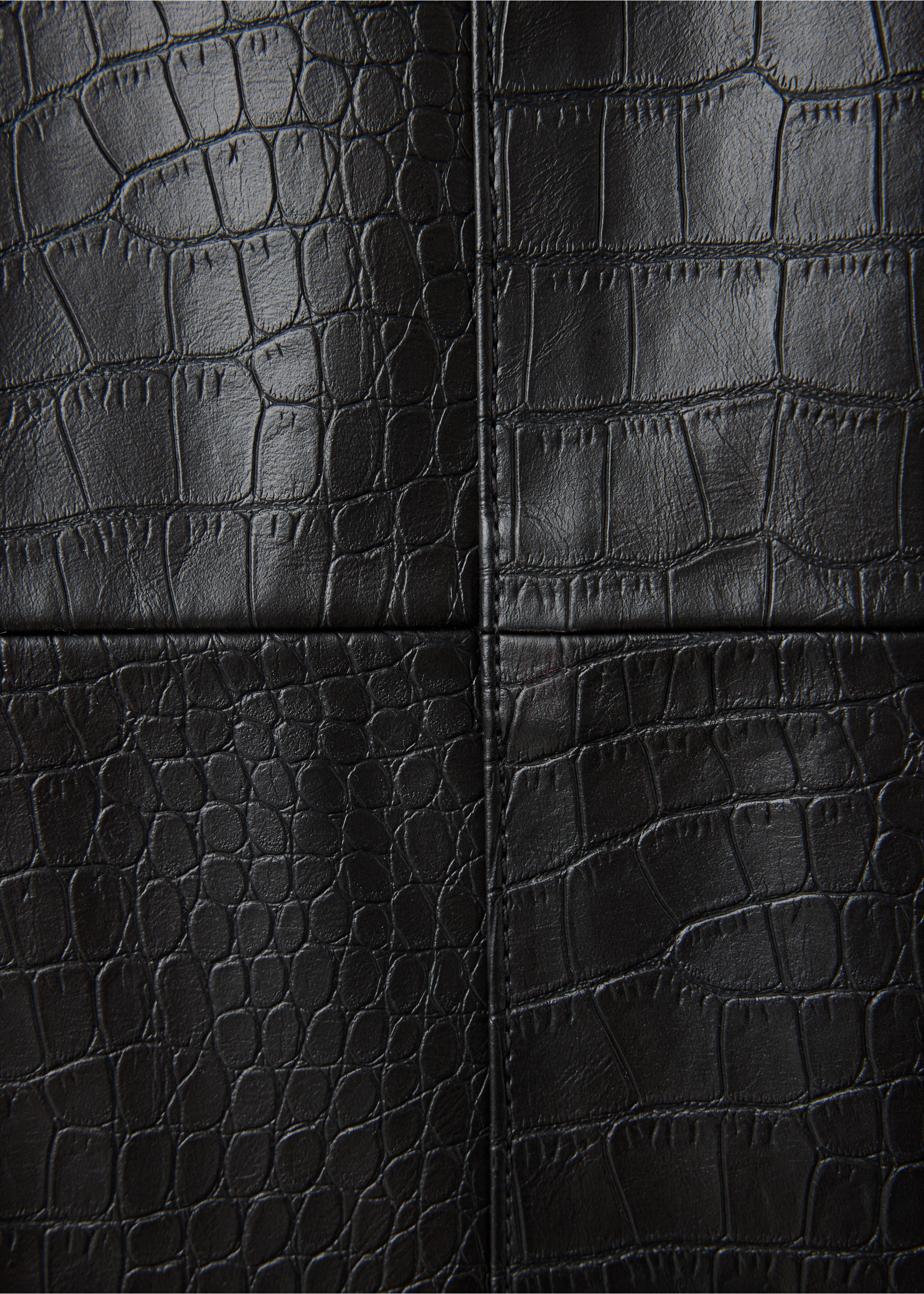 Close-up of black dress fabric with embossed crocodile pattern., Black. Ref: 37007794-00.