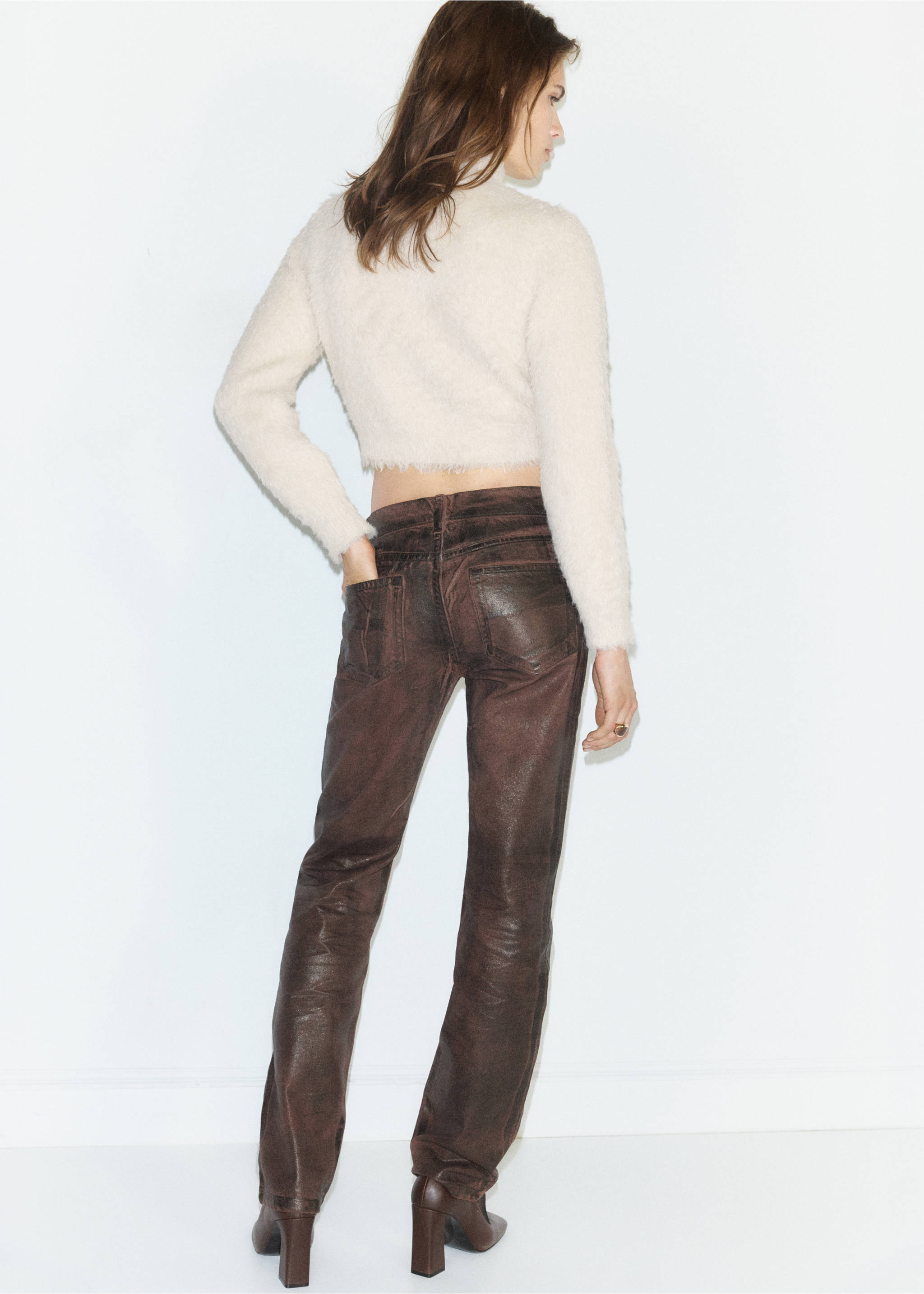 Back view of a light-coloured fuzzy cropped jersey worn with dark trousers., Ecru. Ref: 37007796-00.