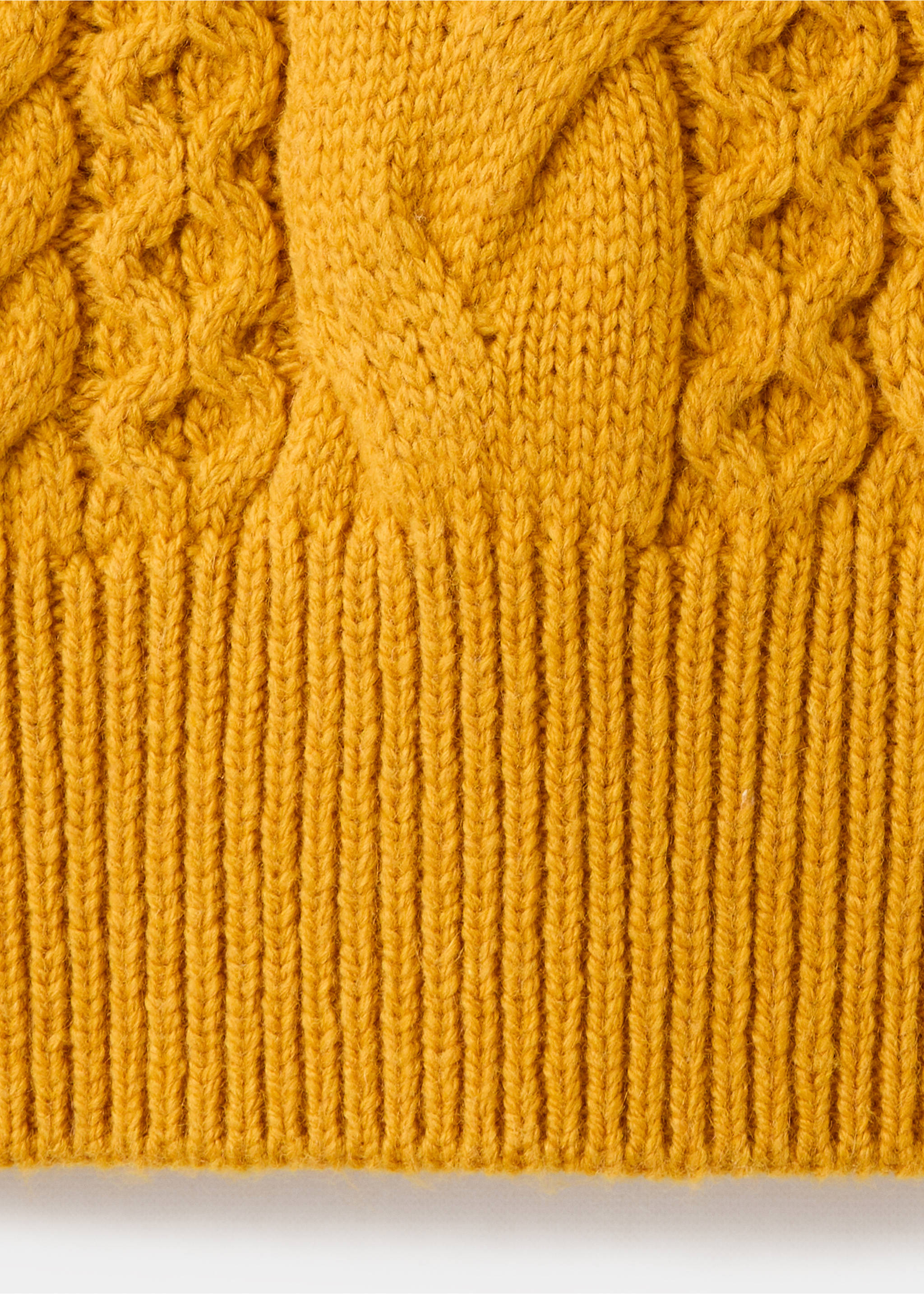 Close-up of mustard yellow cable-knit sweater fabric., Mustard. Ref: 37007801-00.