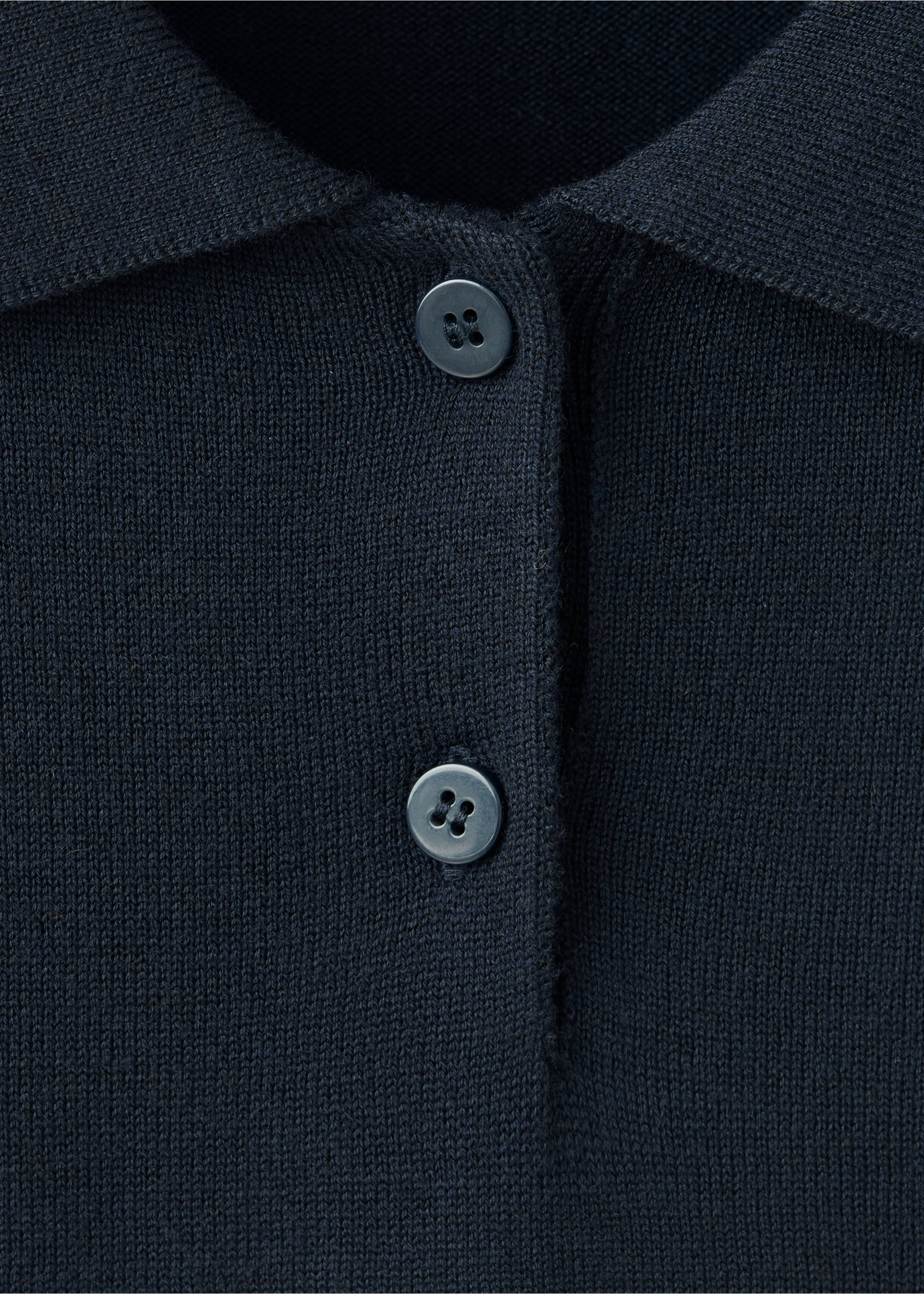 Close-up of a dark blue knitted jersey featuring a collar and two-button placket., Navy. Ref: 37007808-00.