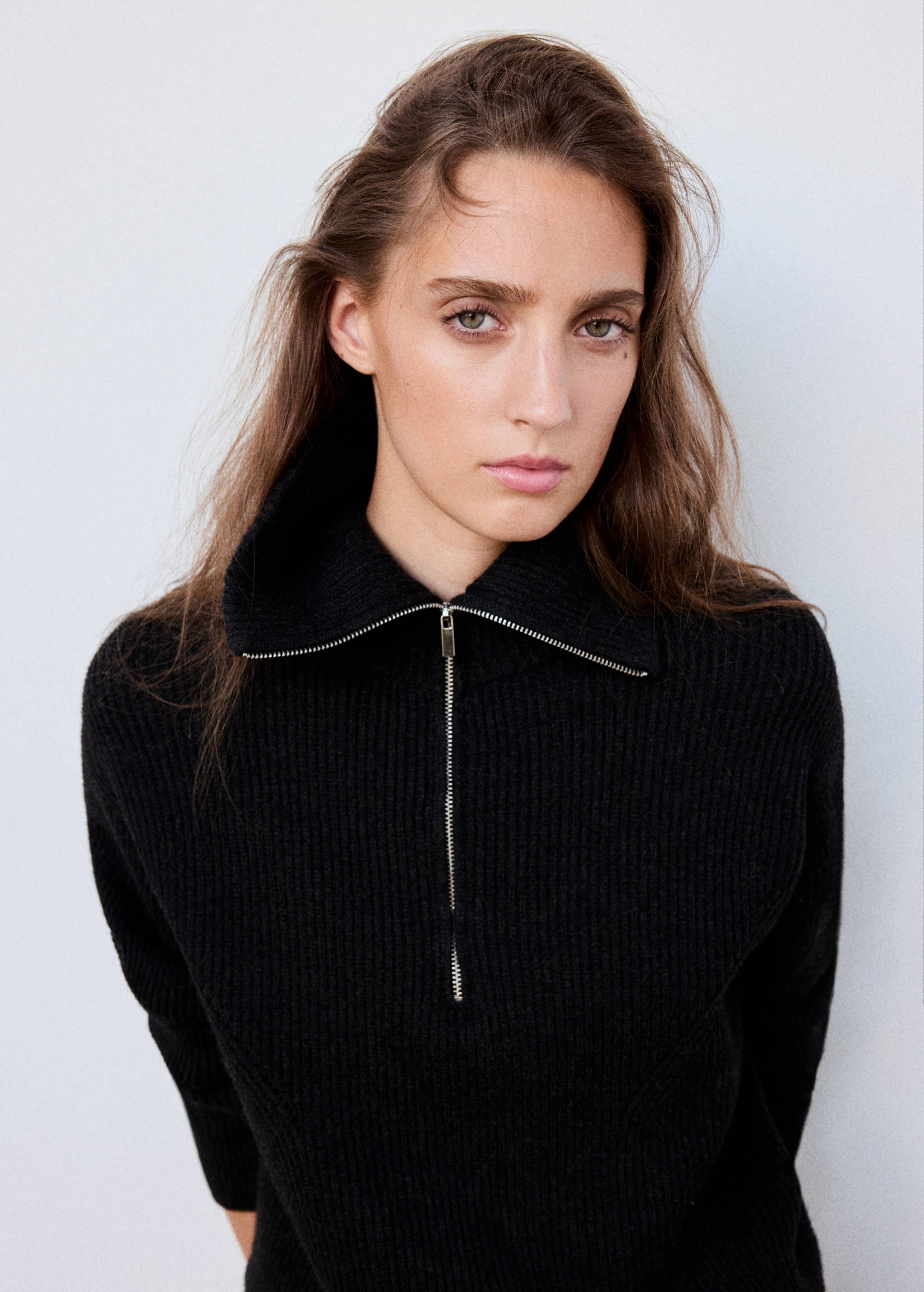 Black ribbed knit jumper with high zip collar