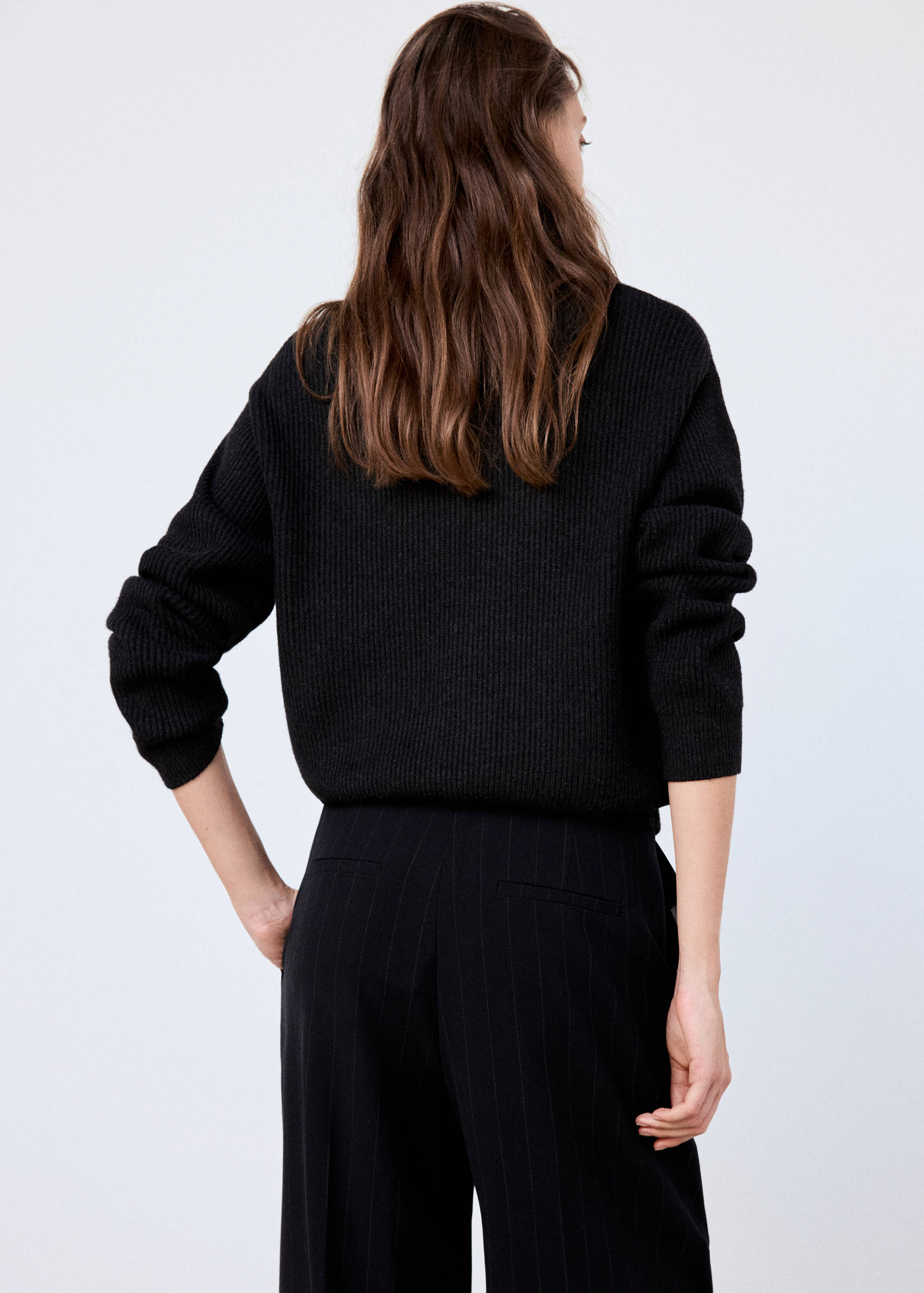 Black ribbed knit jumper, back view.