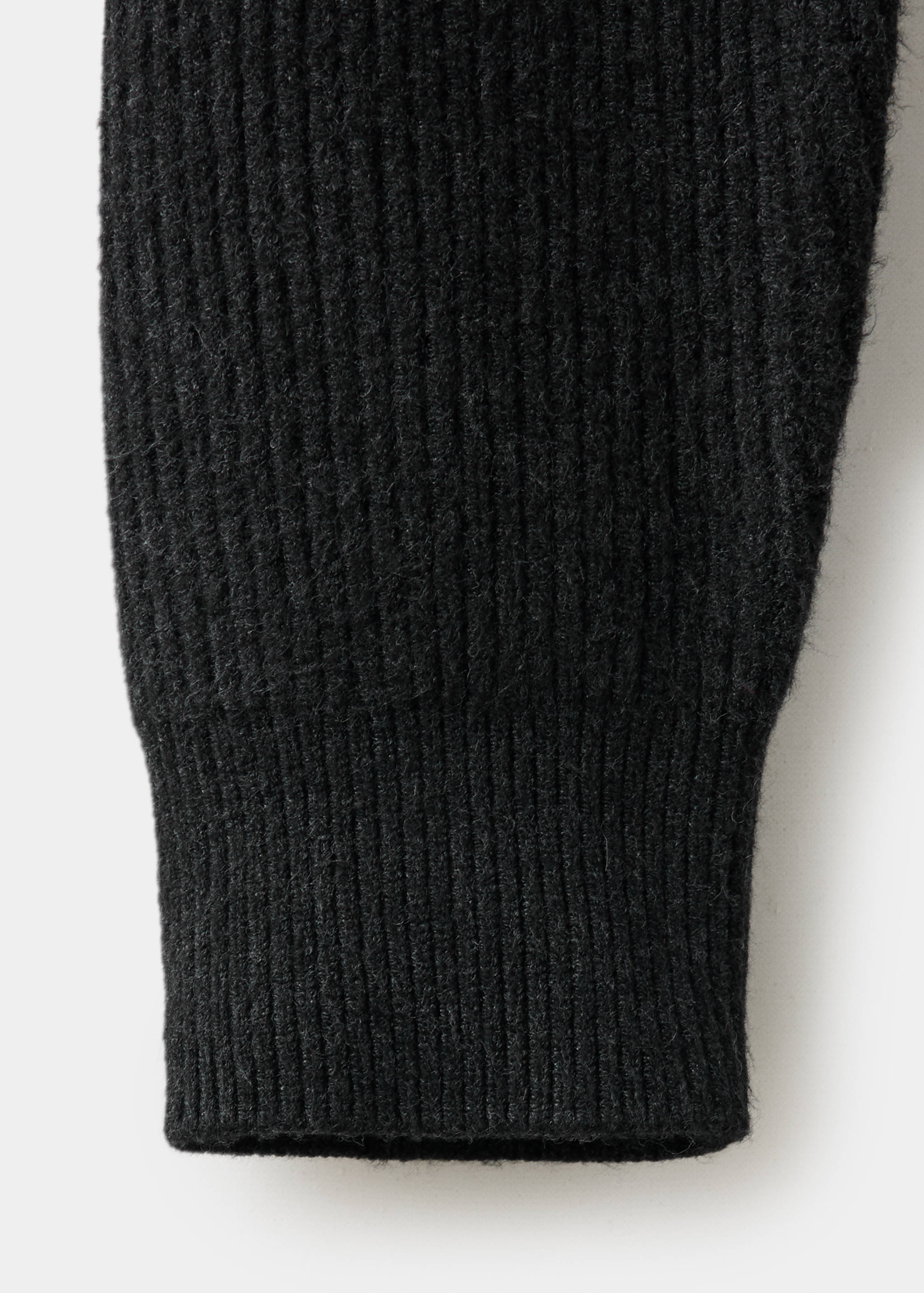 Close-up of a black jersey showing the ribbed knit fabric texture.