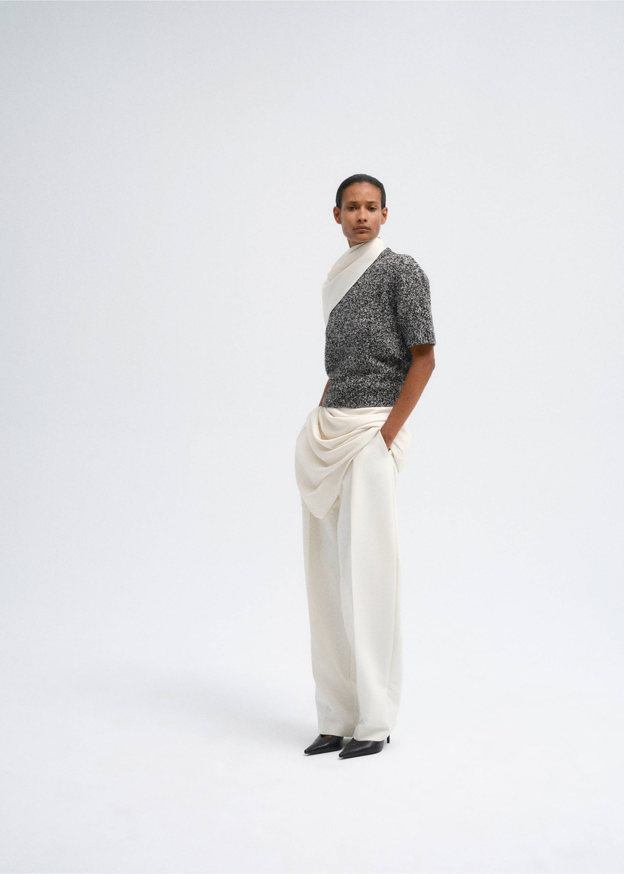 Grey textured knit jersey with a diagonal white overlay, worn with white trousers., Medium Heather Grey. Ref: 37007811-00.